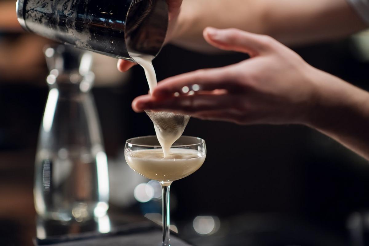Calpis cocktail poured into a cocktail glass