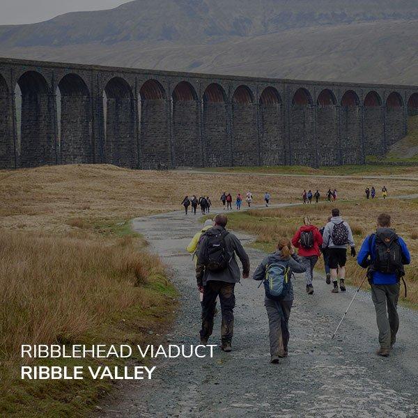 hikers walking towards Ribblehead Viaduct near Carnforth, North Yorkshire 