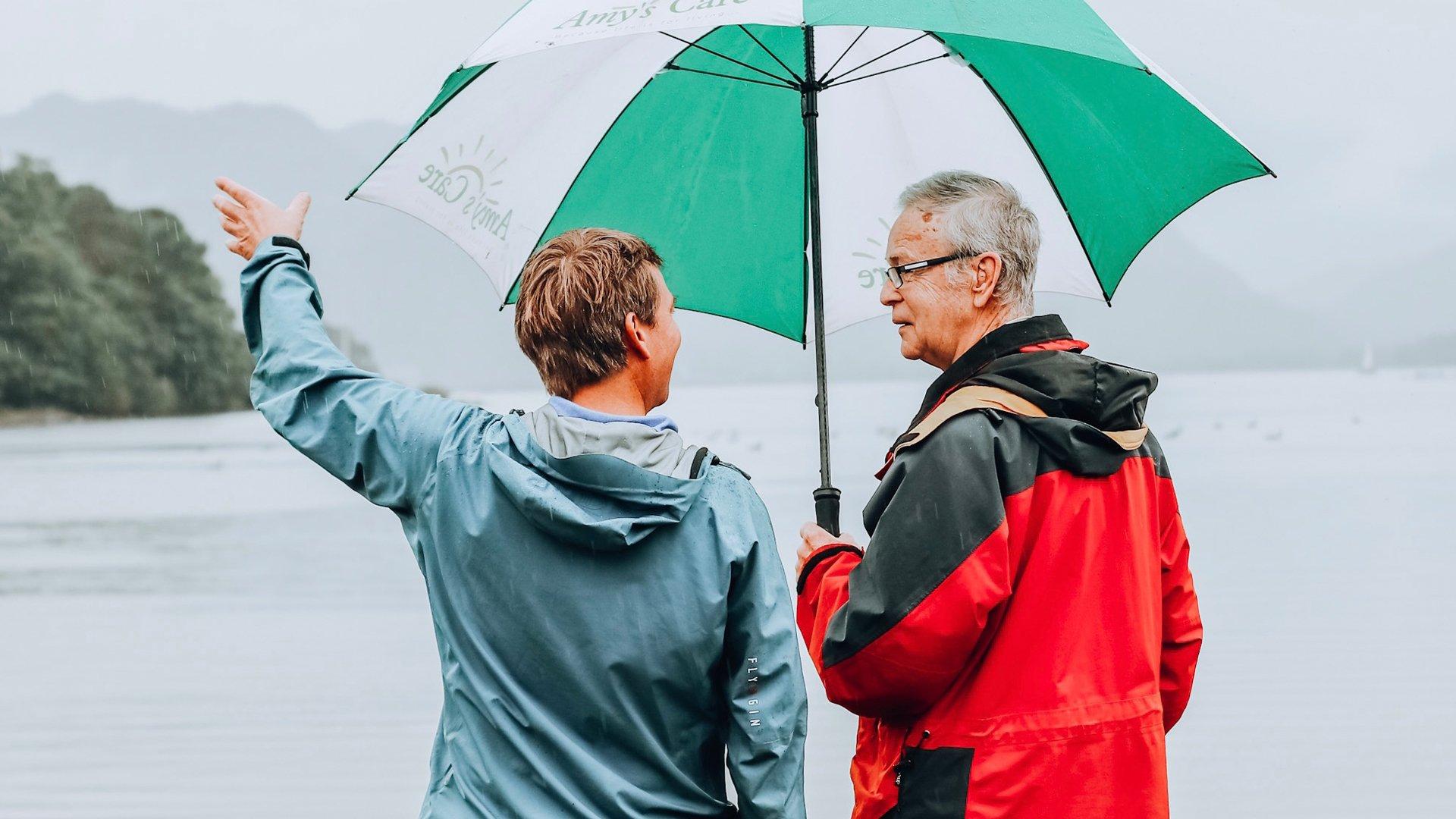 Elderly man and middle aged man enjoying an outdoor adventure in the uk