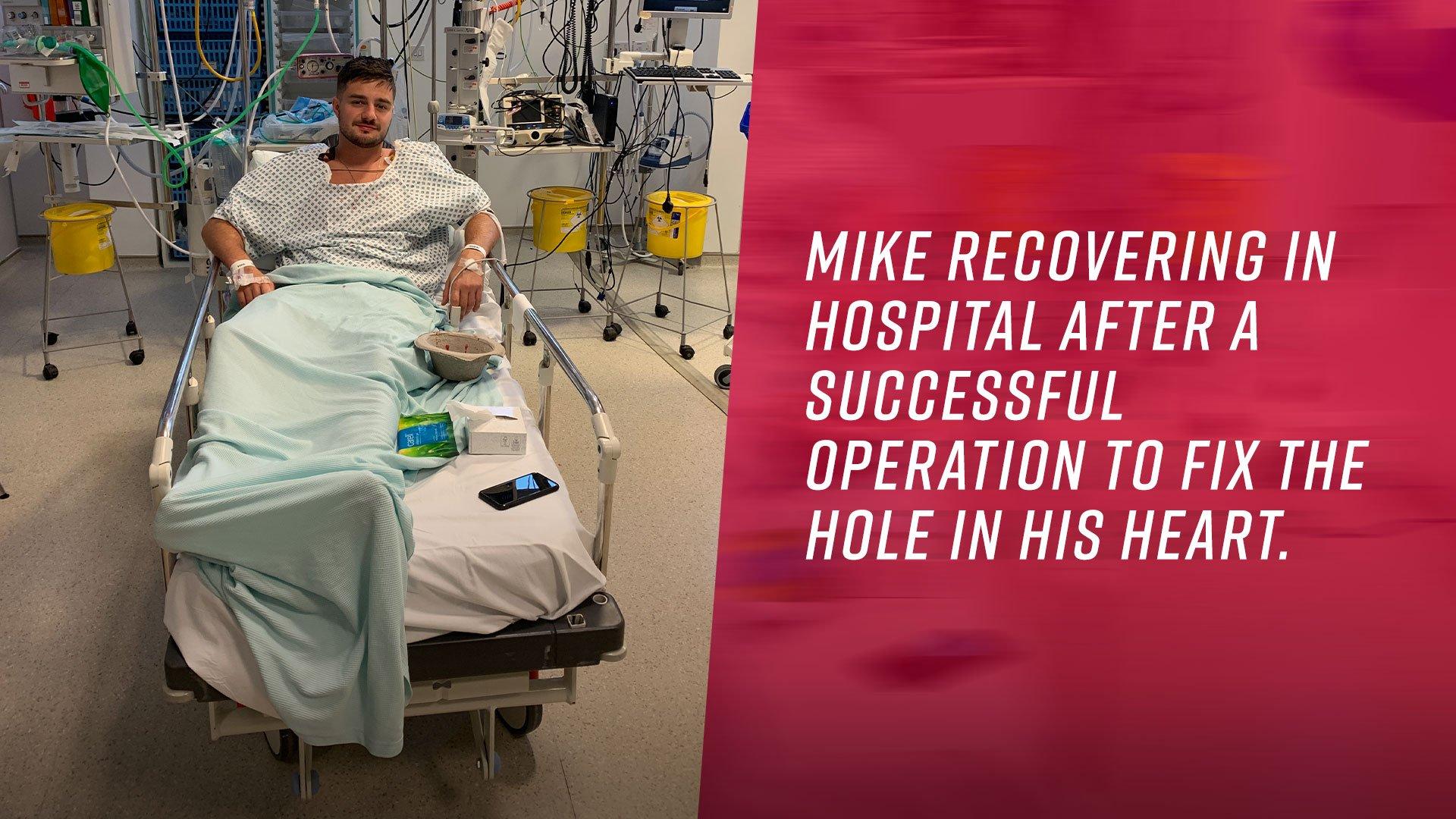 Mike recovering in hospital after a successful operation to fix the hole in his heart.