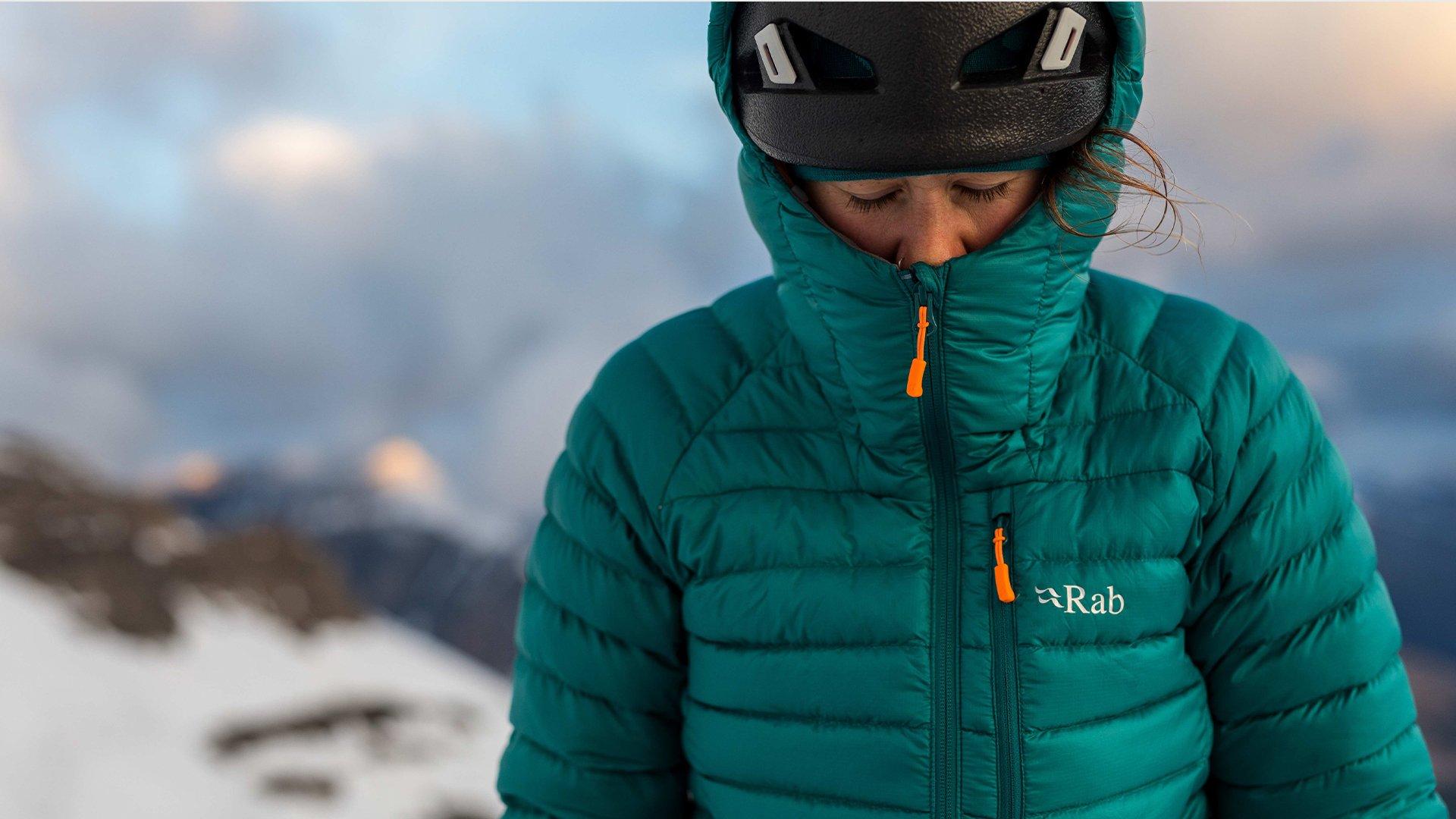 female climber wearing Rab's Microlight jacket