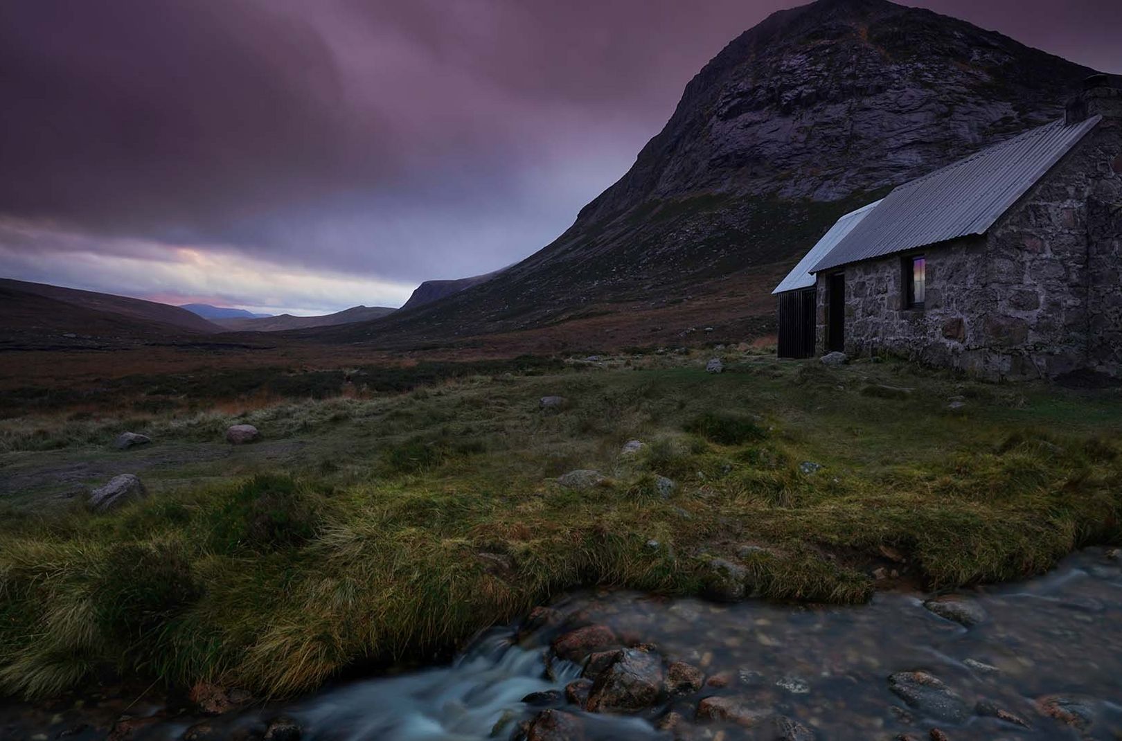the outside of Corrour bothy during the evening