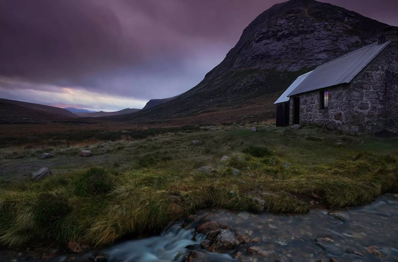 the outside of Corrour bothy during the evening