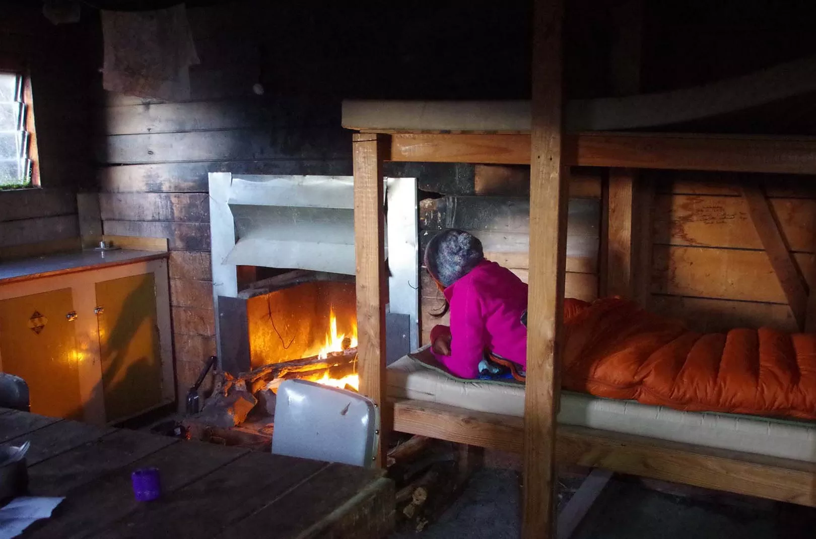 inside a cosy bothy with an open fire