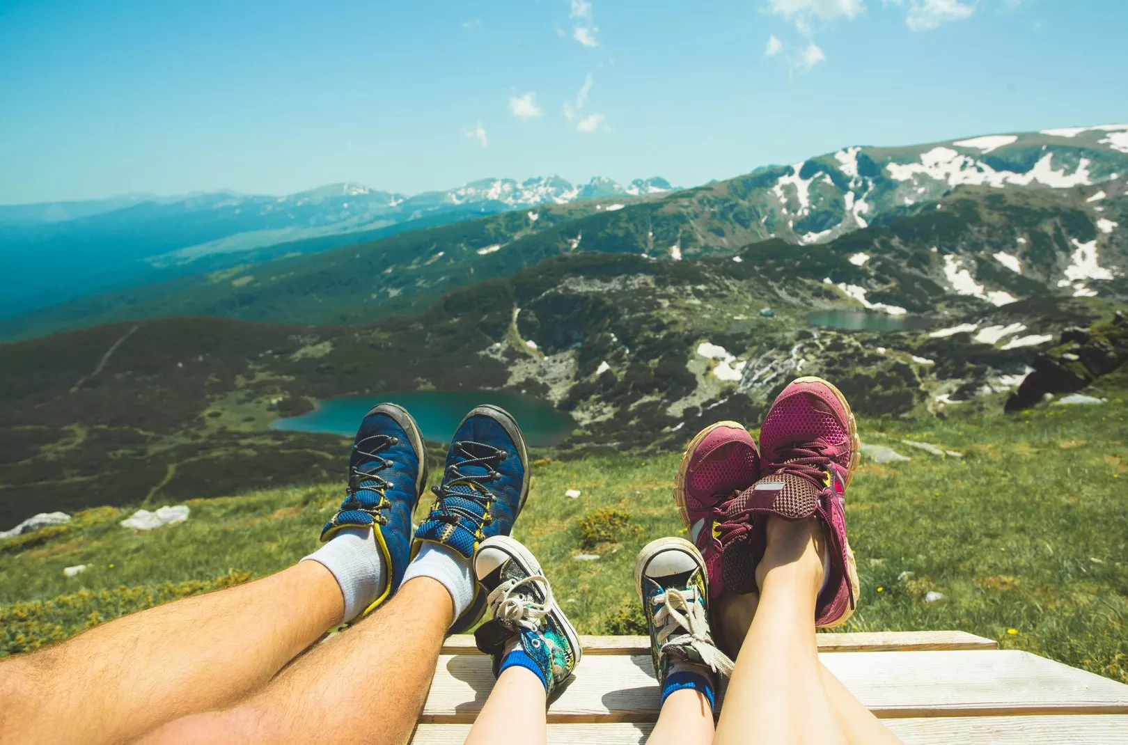 family shoes overlooking a scenic hilltop view