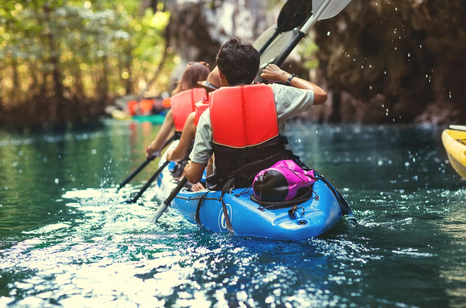 family kayaking together
