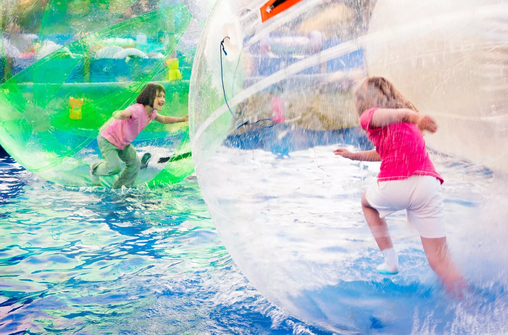 kids zorbing on water