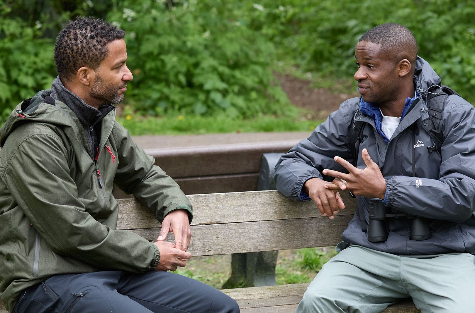 Sean Fletcher and Ollie Olanipekun sitting on a bench talking
