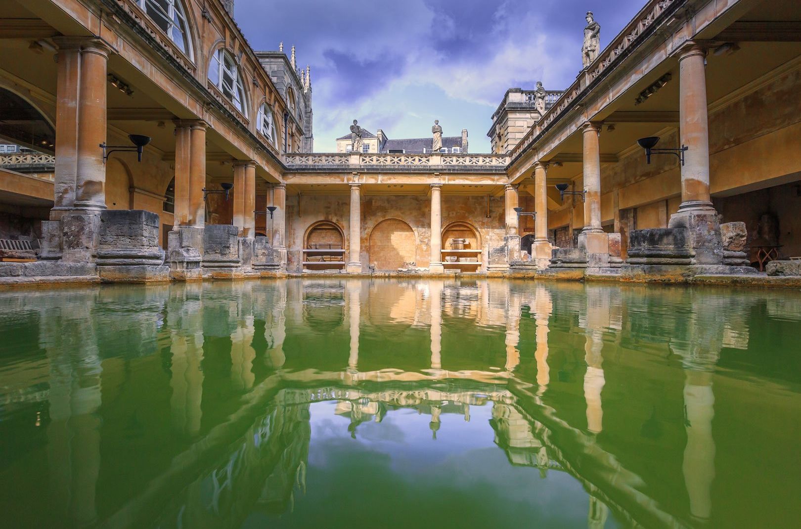 View from the water's surface of the Roman Baths in Bath