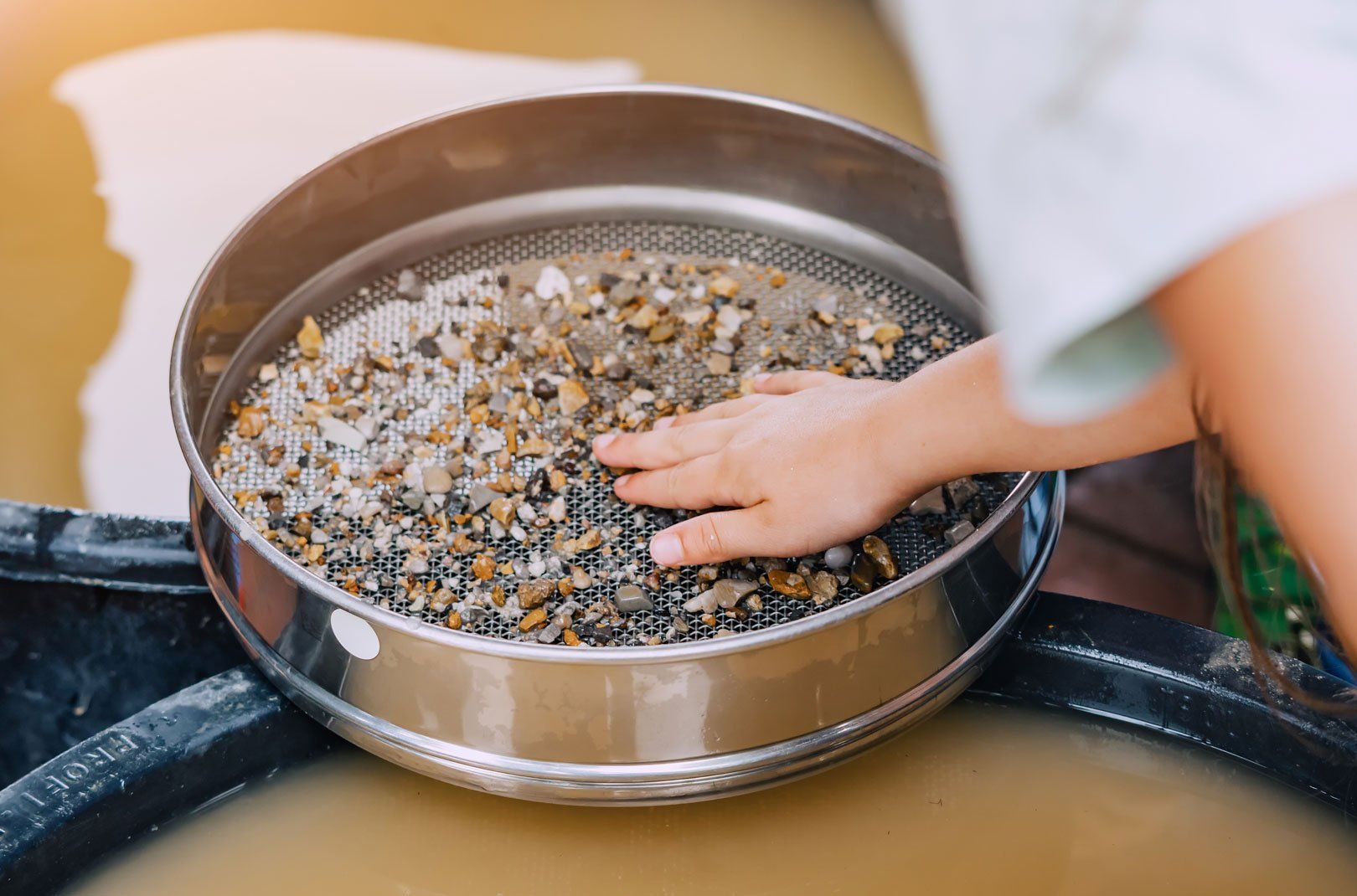 Child using gold pan