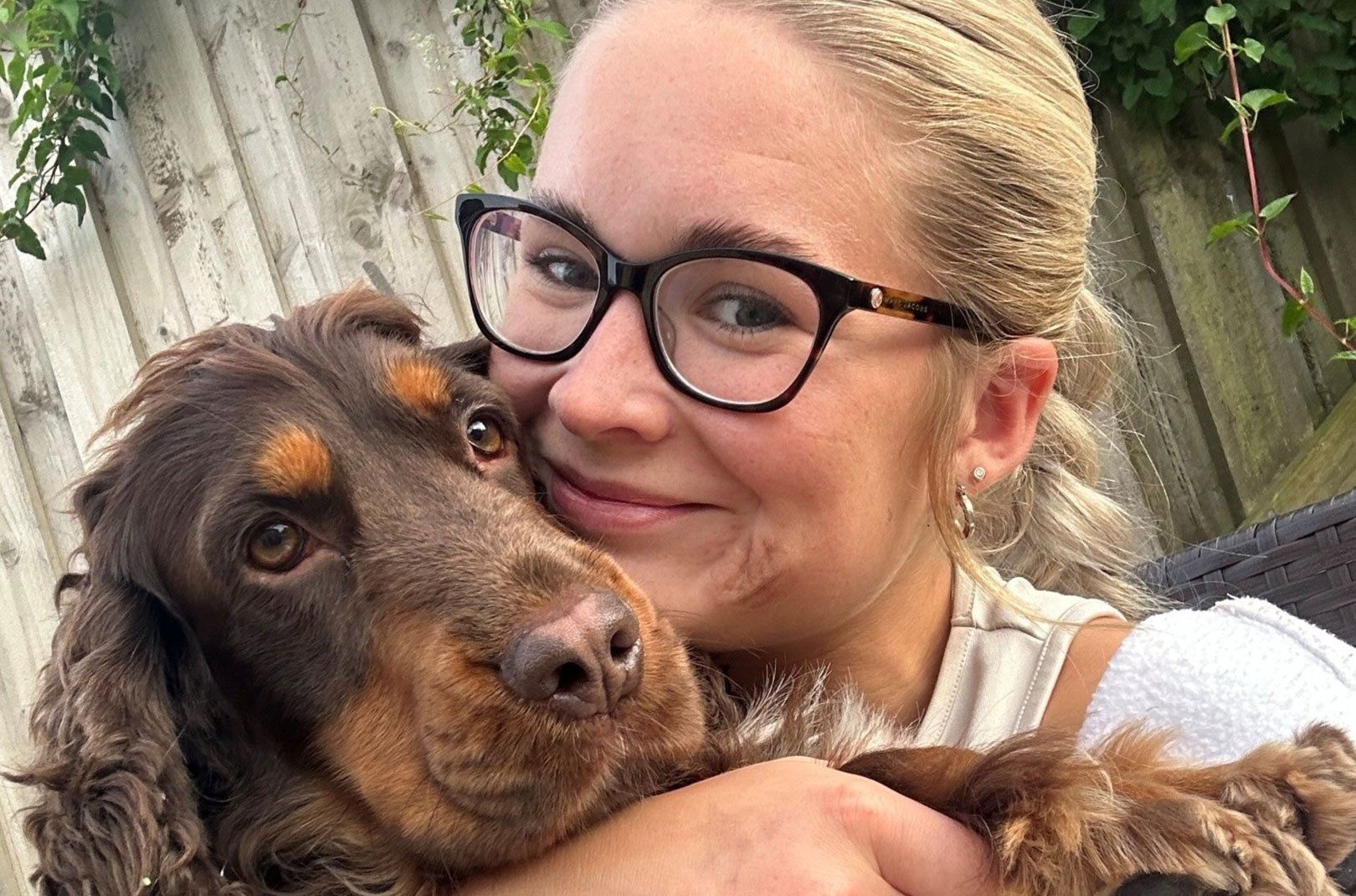 A selfie of Olivia Cunningham of Tails of Bamford with a dog.