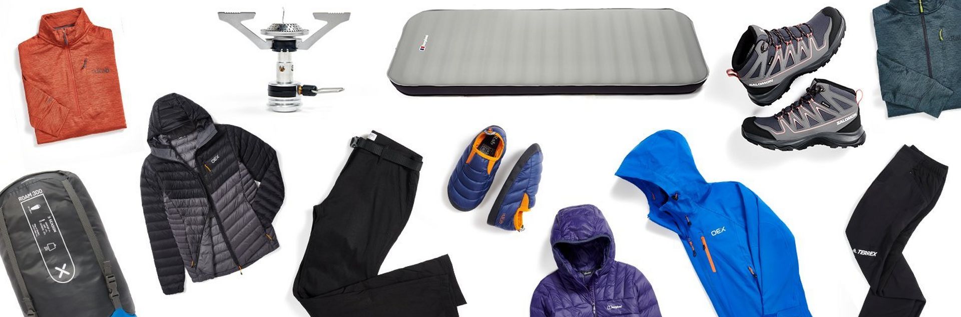 A flatlay image of outdoor products including men's clothing, women's clothing and tents and camping equipment