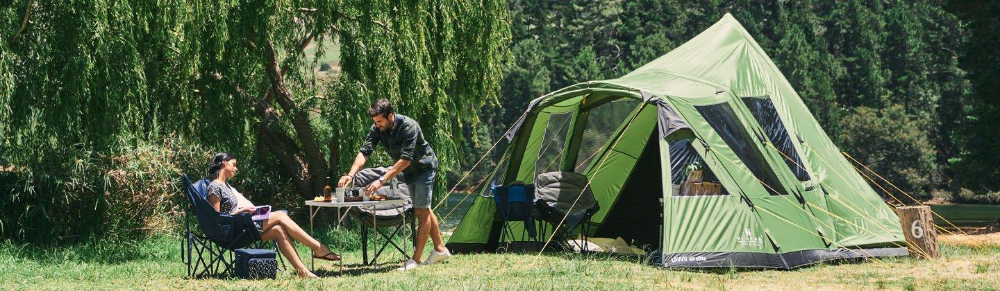 A couple camping with a picnic