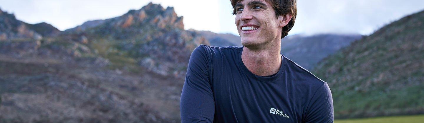 Man crouched down wearing longsleeve baselayer