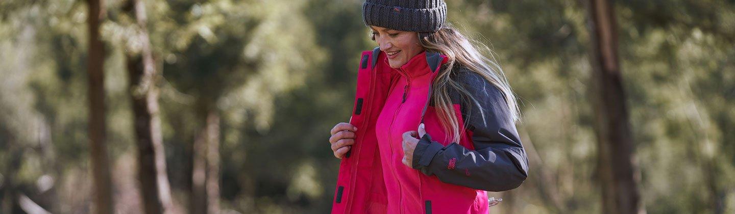 Woman walking in a fleece and jacket