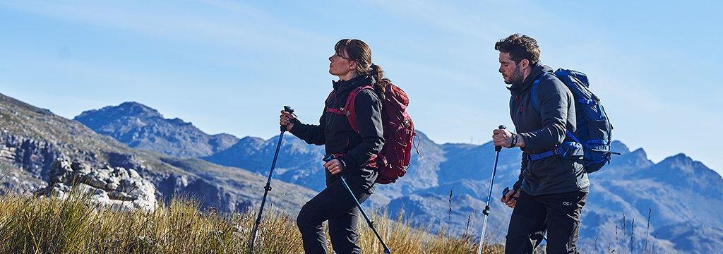 People hiking in the mountains wearing softshell jackets