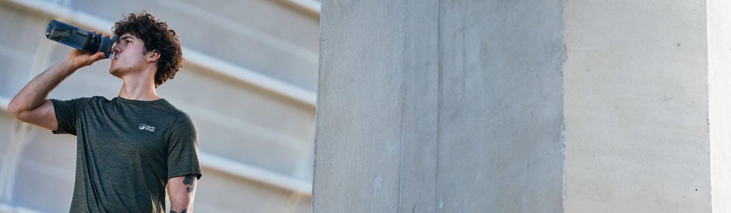 A person drinking from ma water bottle