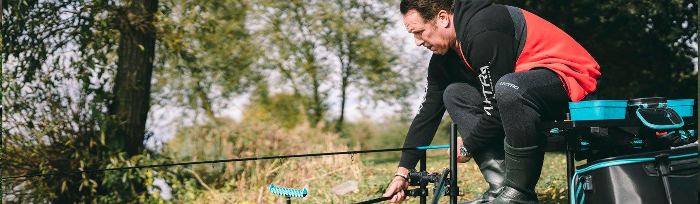 A person fishing at a river