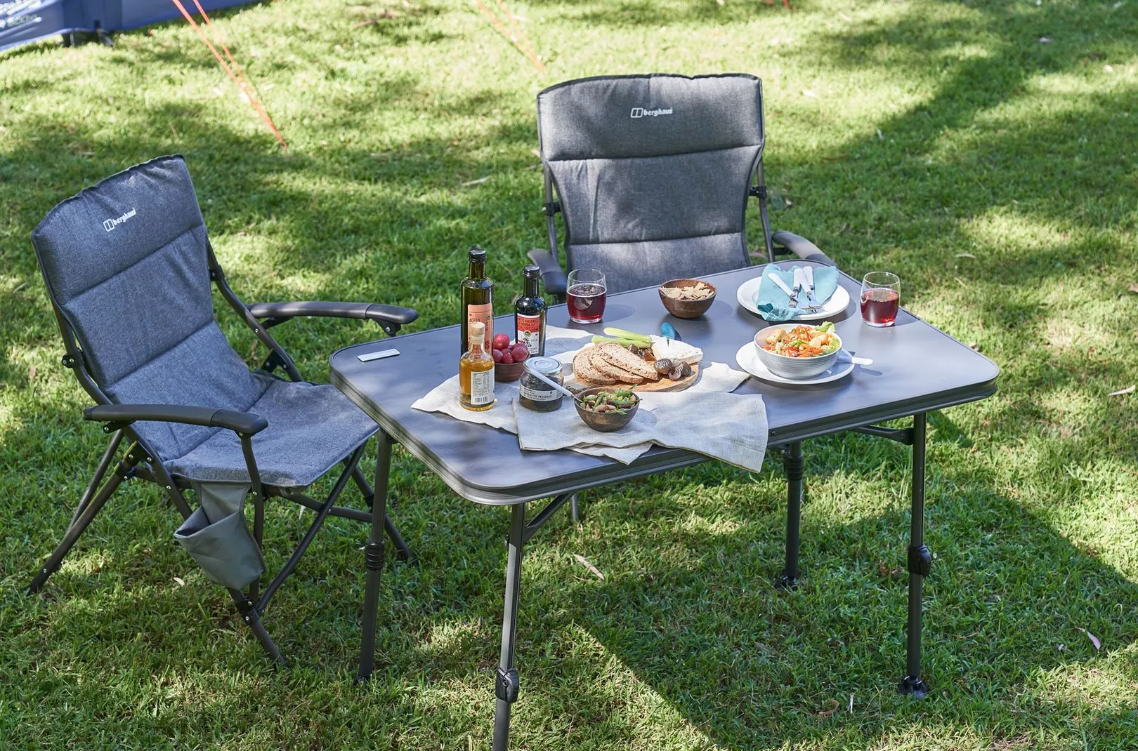Berghaus chairs setup with table and food