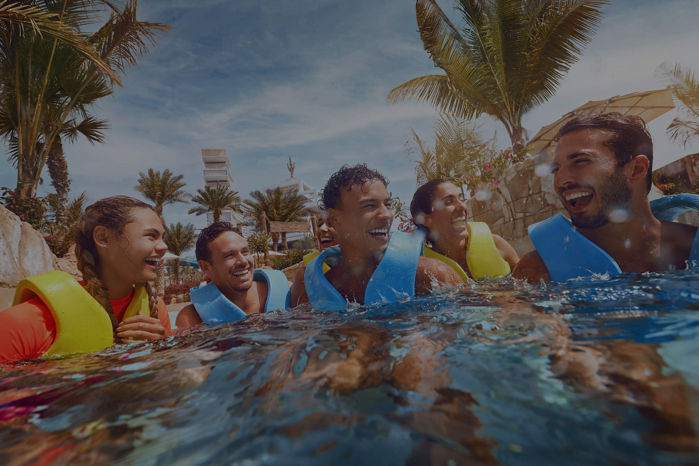 Group of Friends at Aquaventure River Rapids with Dark Overlay