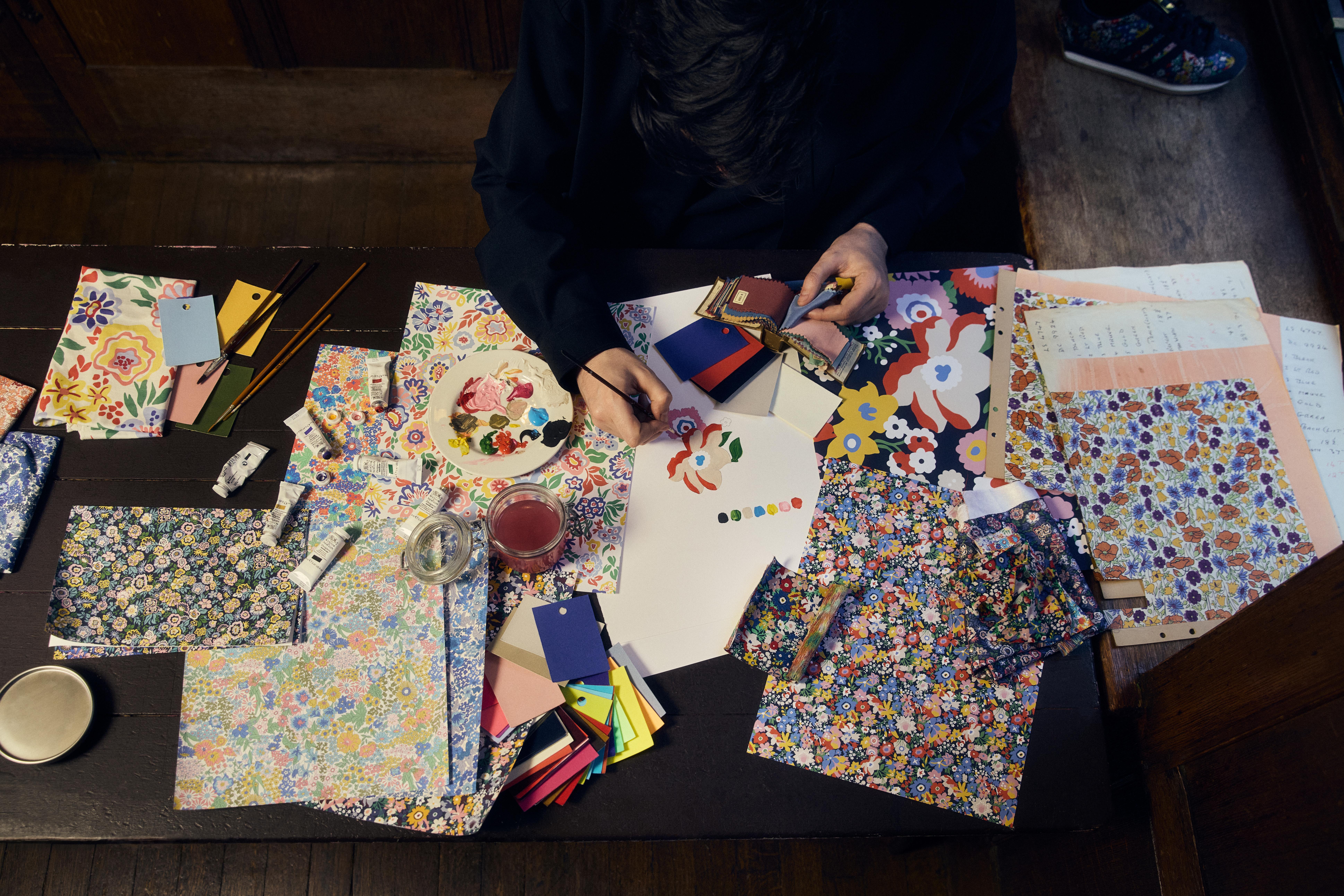 A table showing a sketch of a floral print and swatches of classic multicoloured floral fabrics