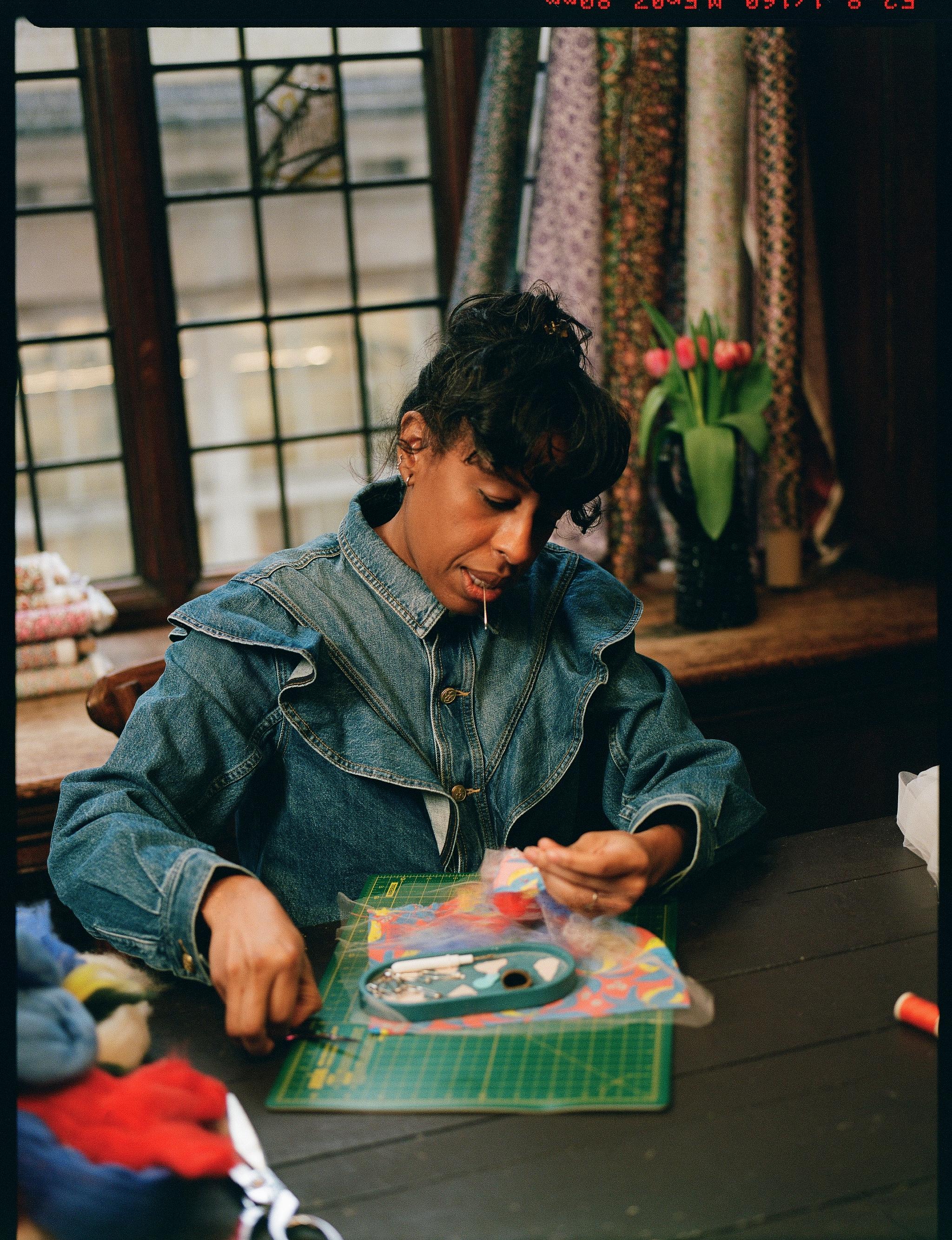 Artist and art historian Ferren Gipson makes a patchwork square as part of Liberty's Patchwork Collective