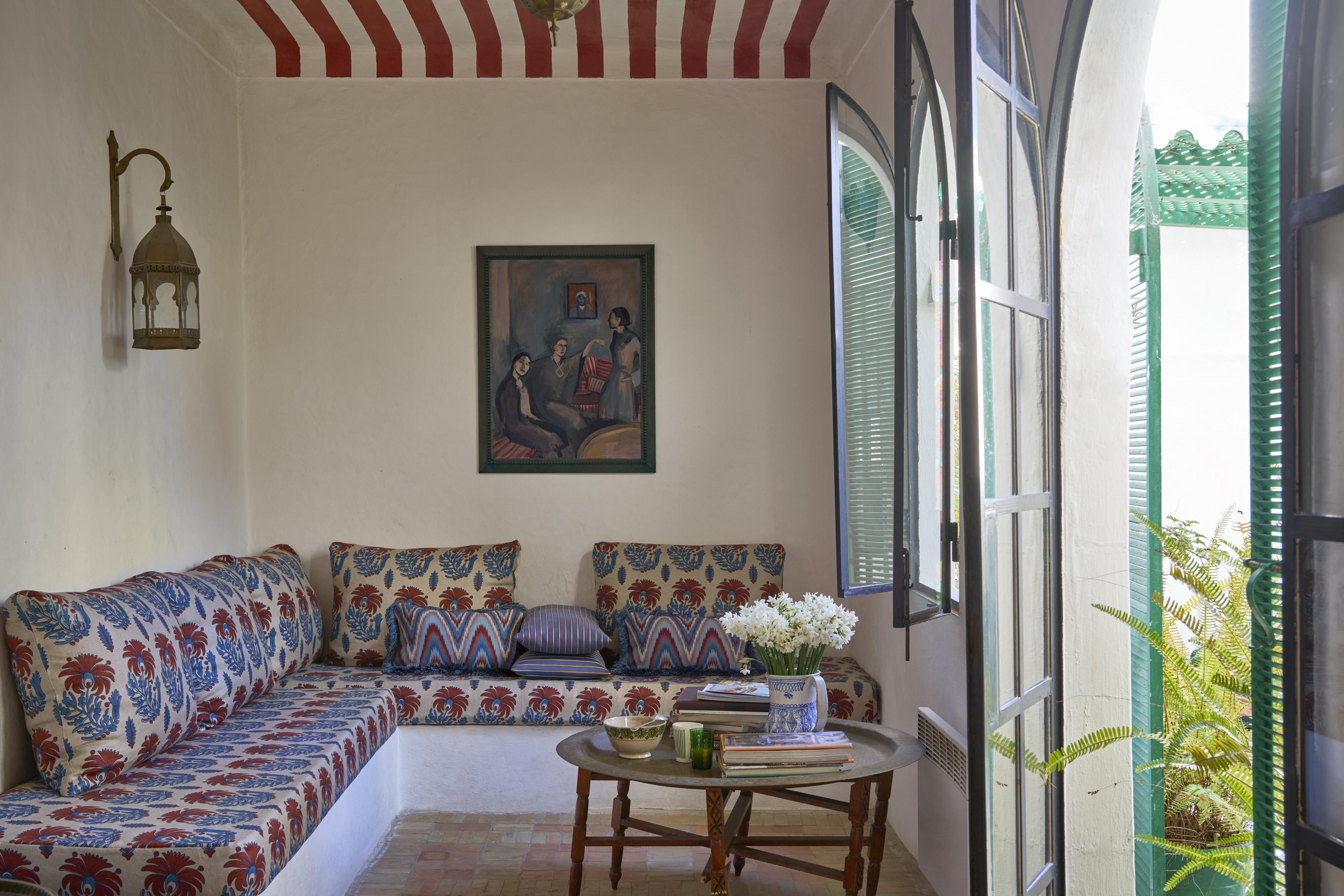 Banquette seating and cushions upholstered with Liberty Interiors Palm Parade fabric in Lapis
