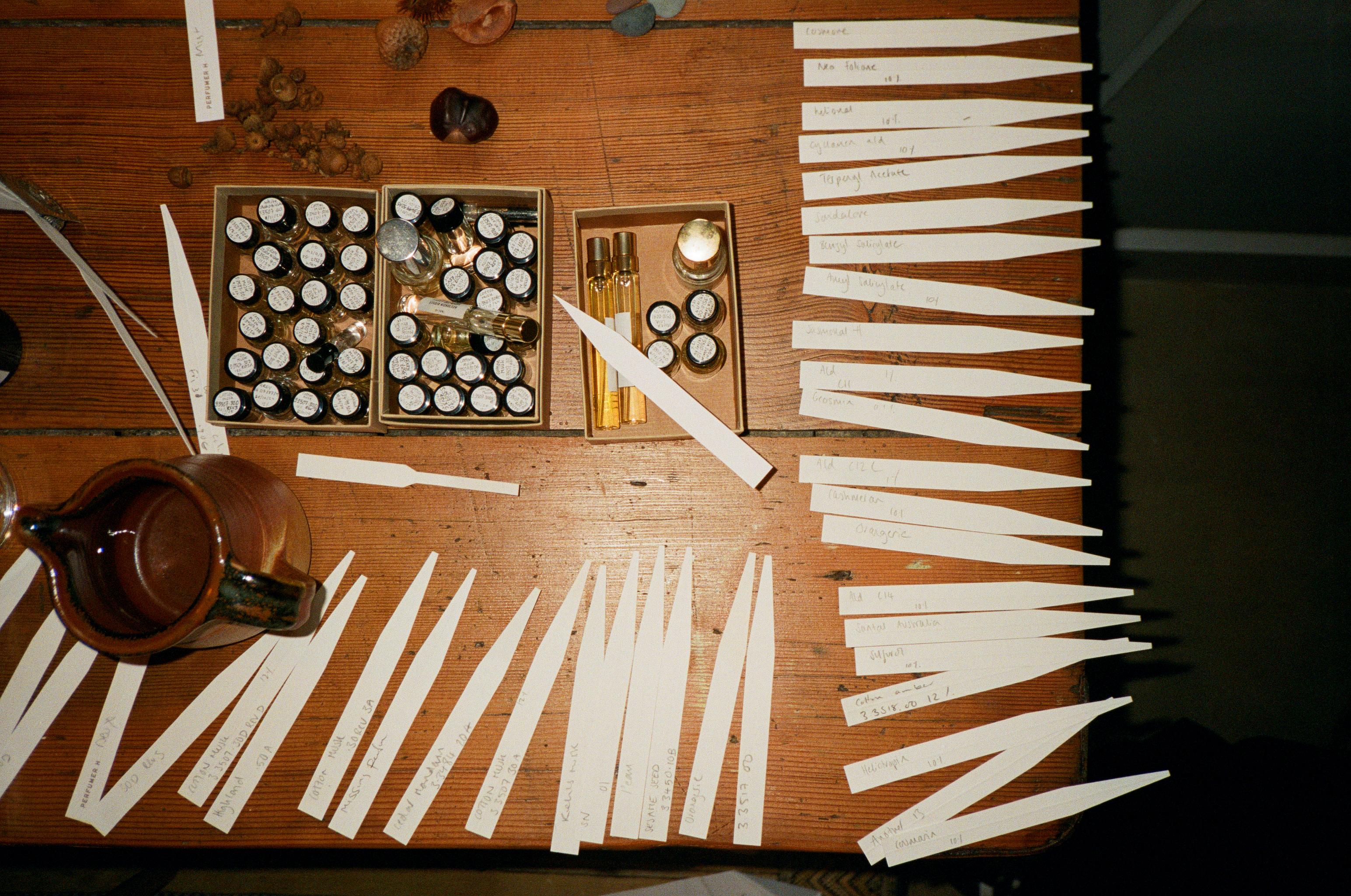 A selection of fragrance blotters of the desk of perfumer Lyn Harris