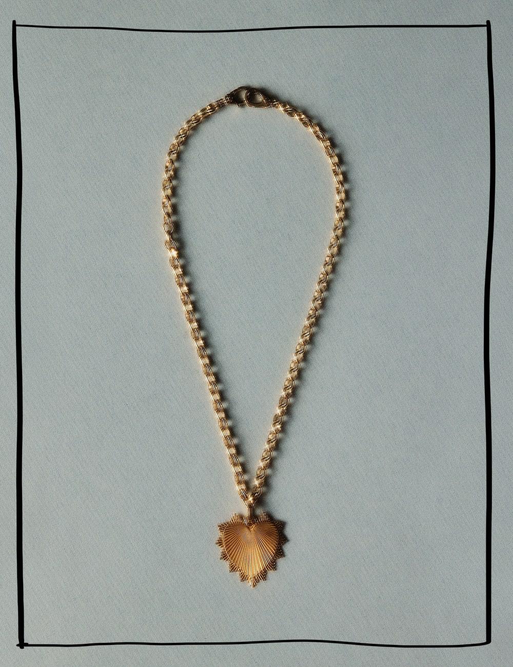 A gold necklace from the brand foundrae