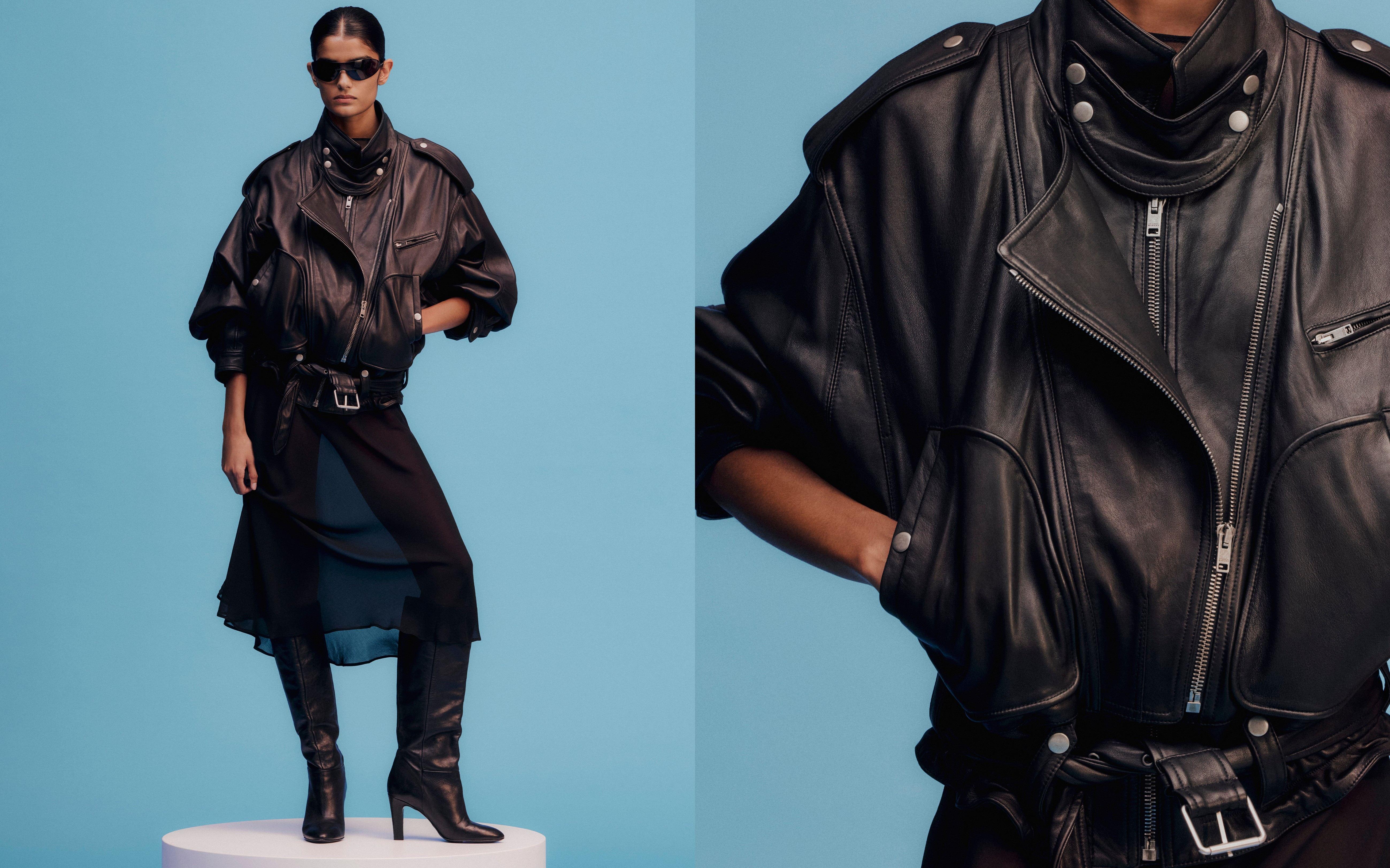 Model wears a sheer dress, leather biker jacket, black knee-high boots and a pair of black sunglasses