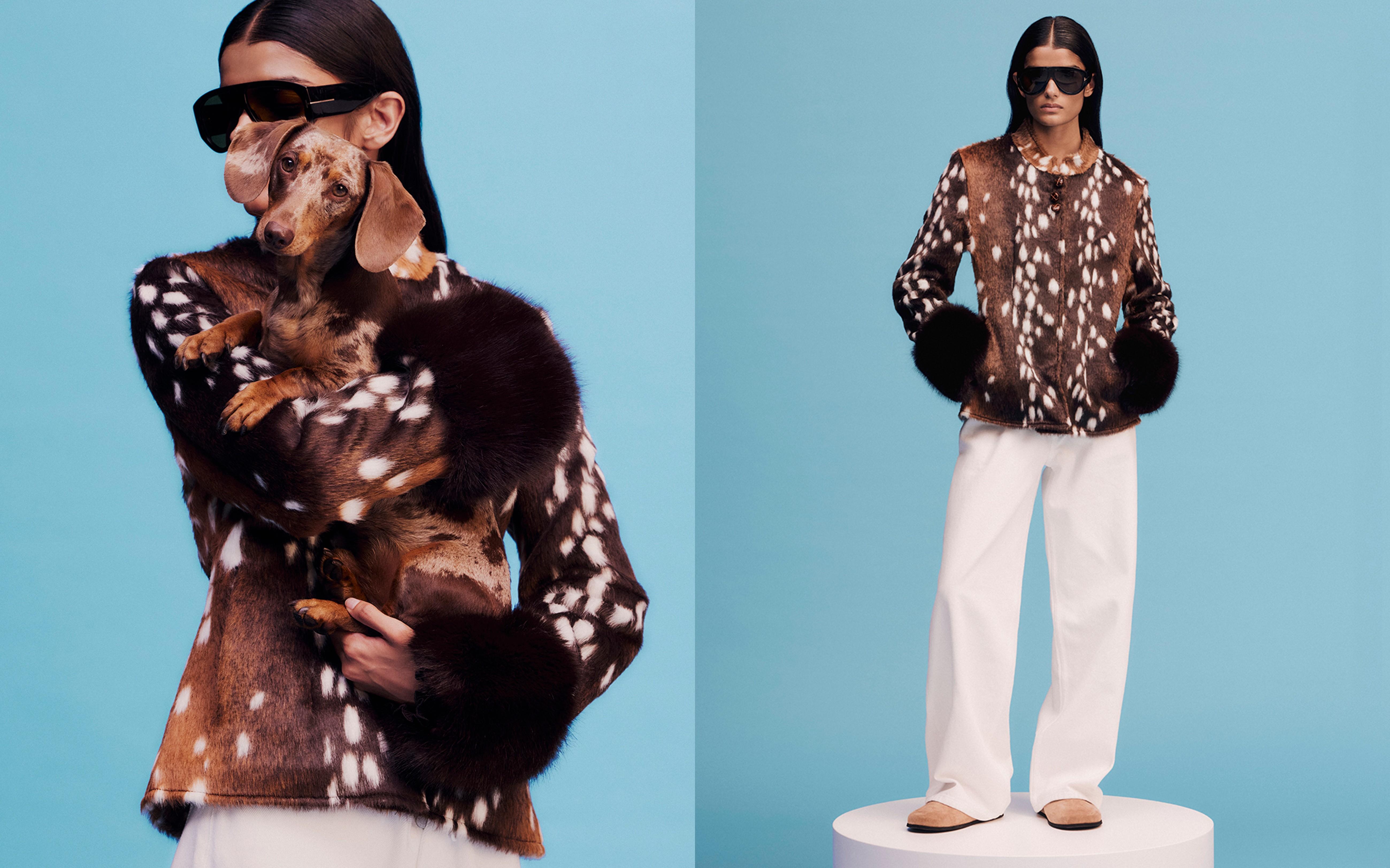 Model holding a dachshund, wearing a bambi-print jacket, white wide-leg jeans, suede mules and a pair of black oversized sunglasses