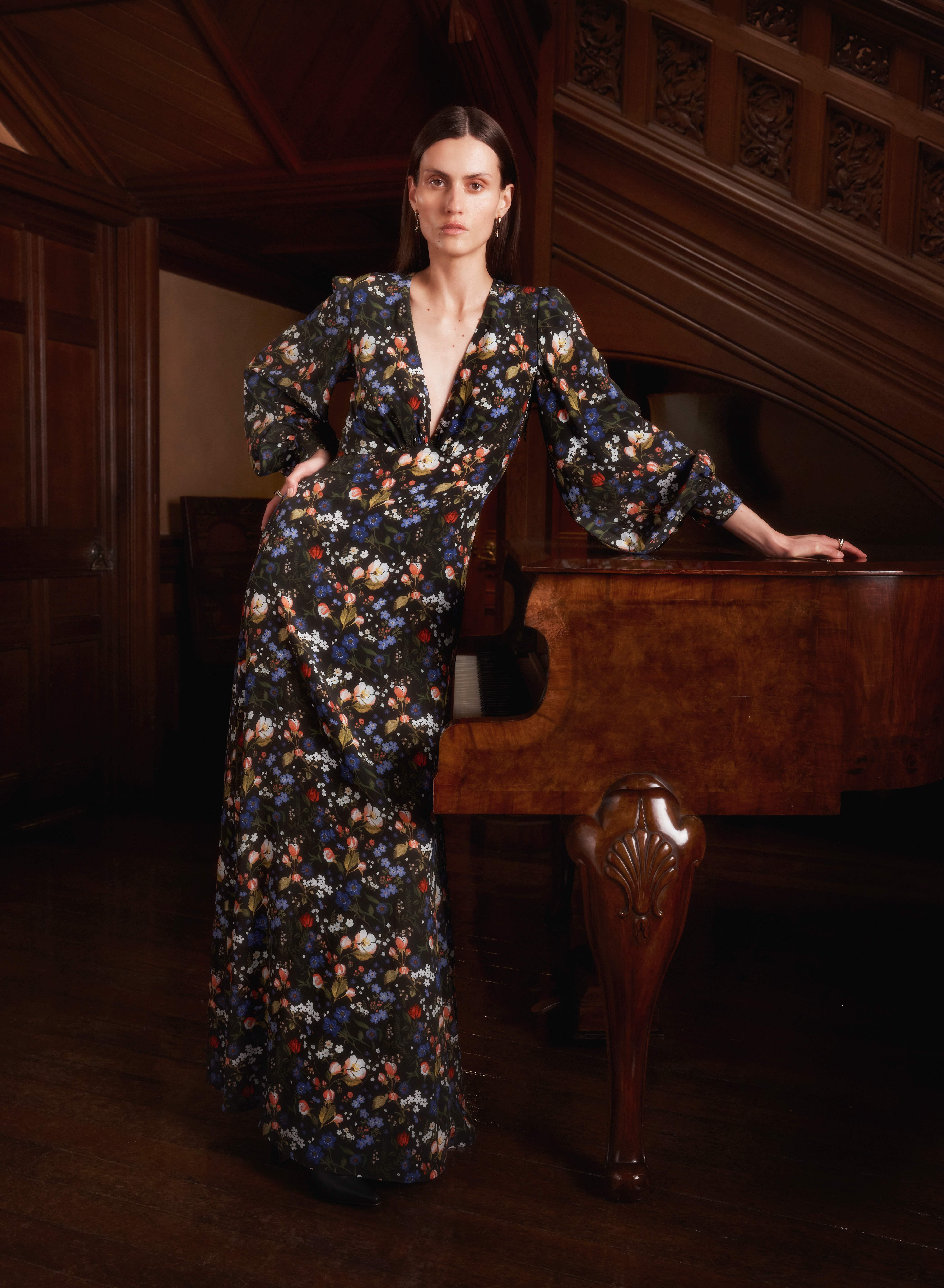 Model wearing a silk Liberty Maxi Dress in Peacock Manor print 