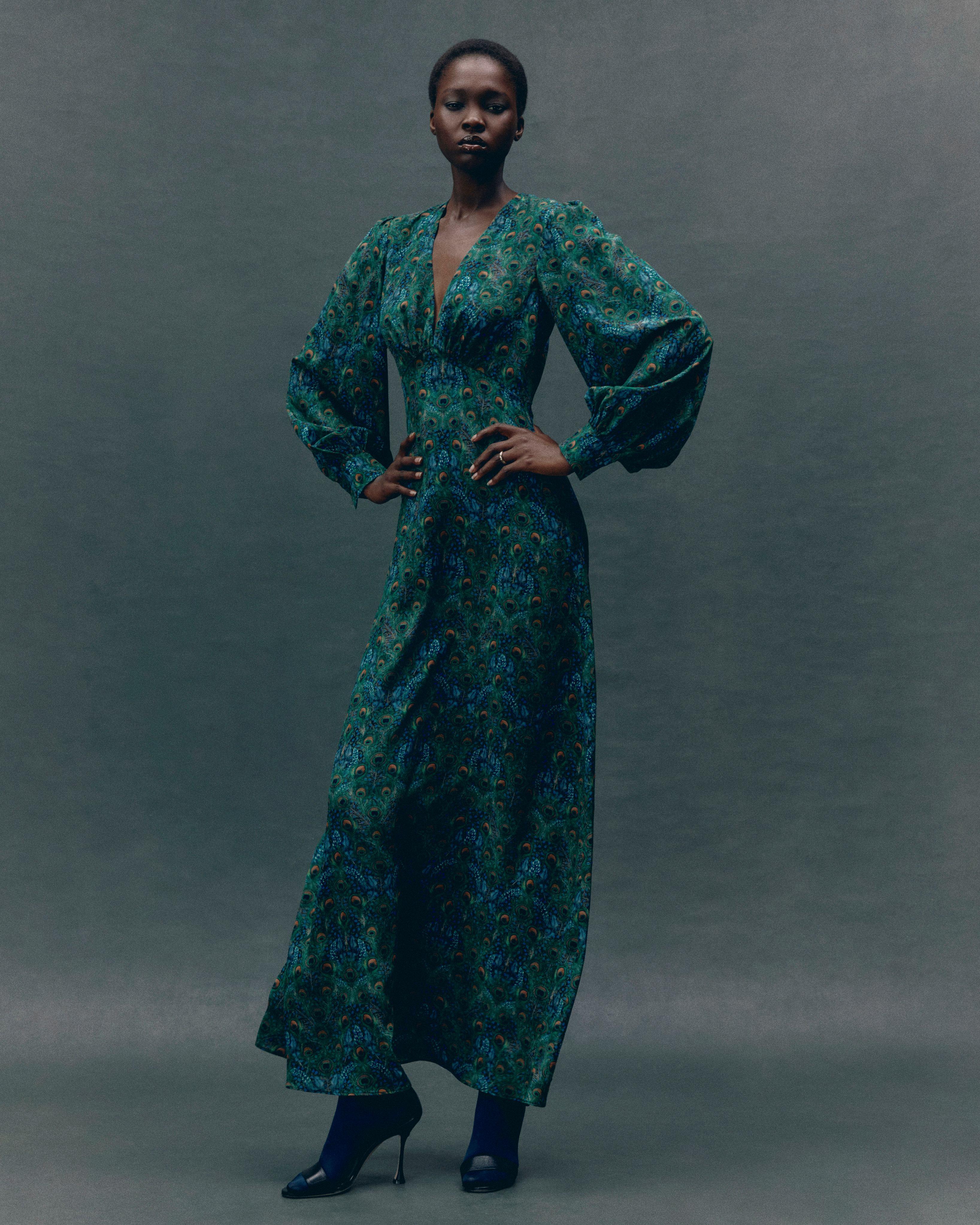 Model wearing a silk Liberty Maxi Dress in Peacock Manor print 