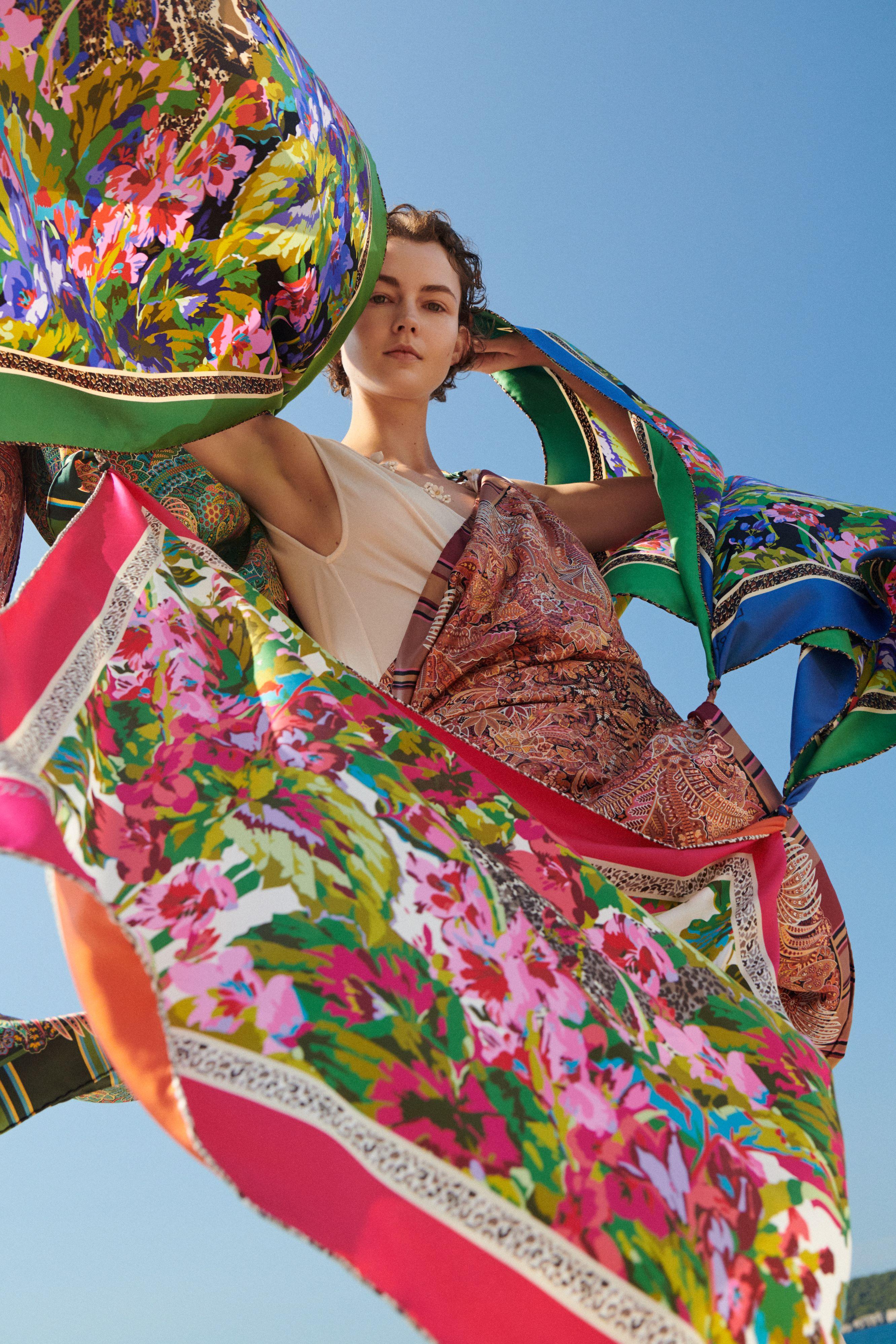 A woman wearing a luxury Liberty print scarf