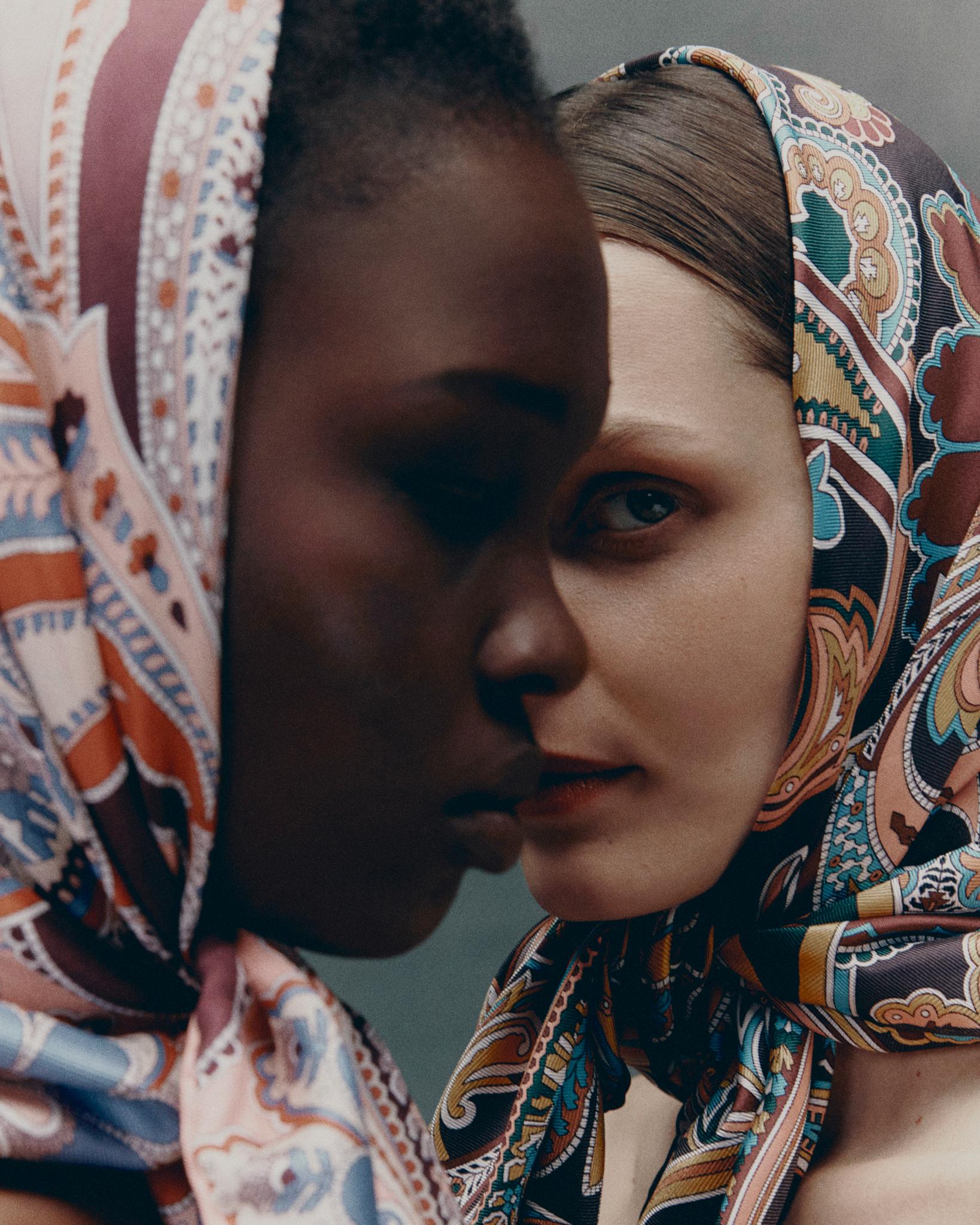A woman wears a Liberty scarf