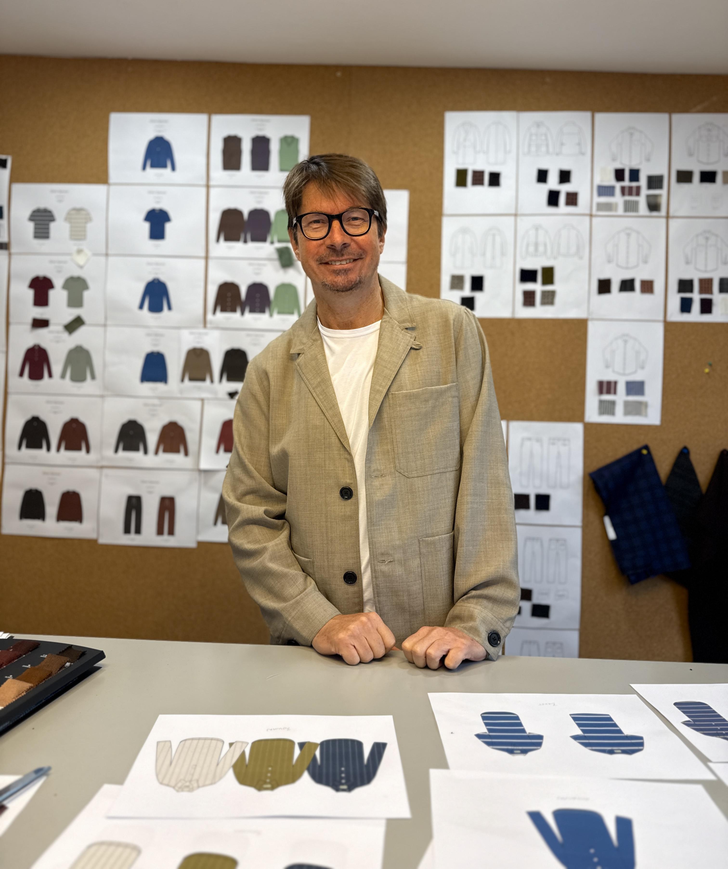 Oliver Spencer amongst swatches and sketches in his London studio