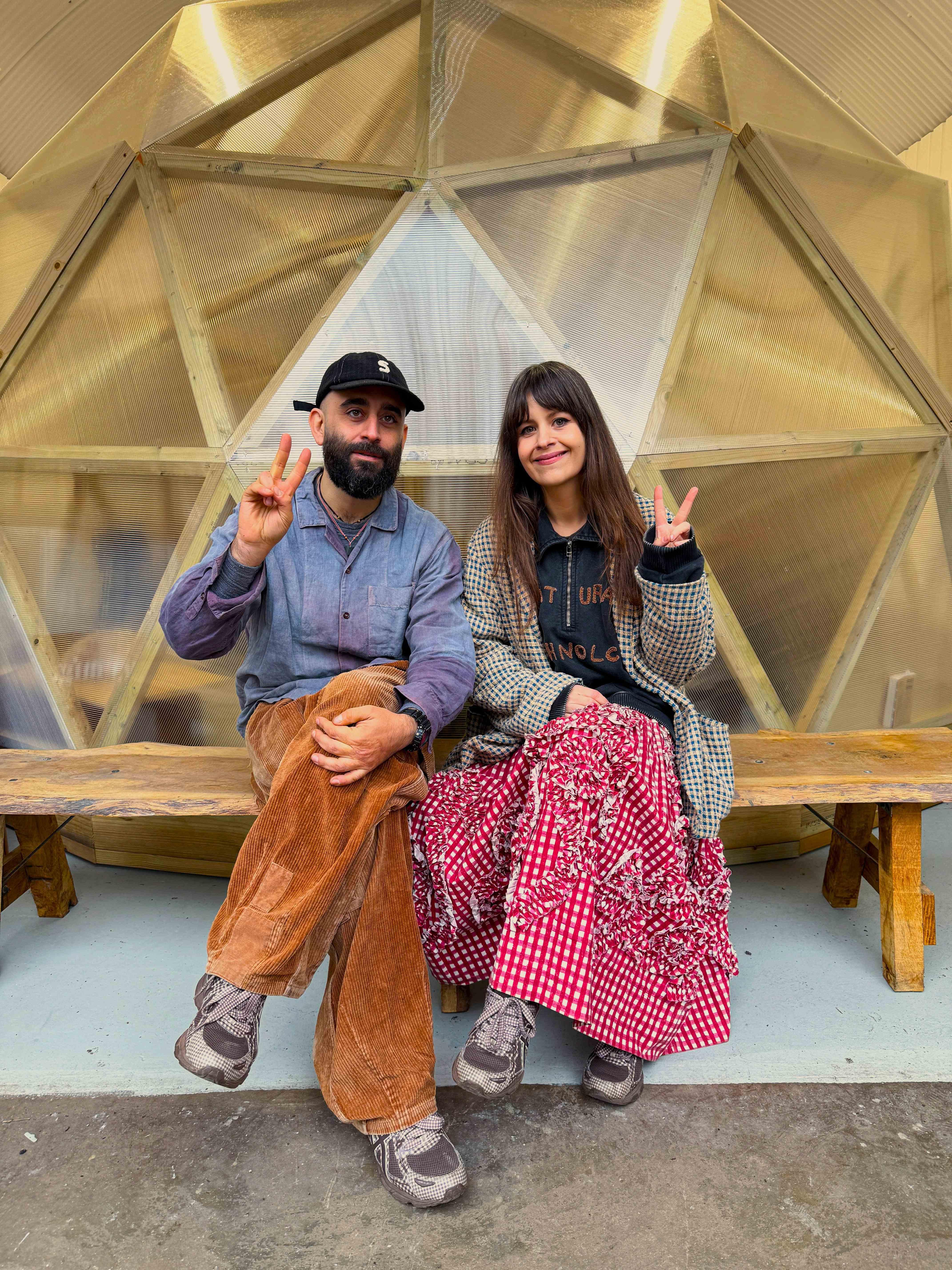 Katy and Saeed Al-Rubeyi, founders of Story Mfg., sitting outside their studio