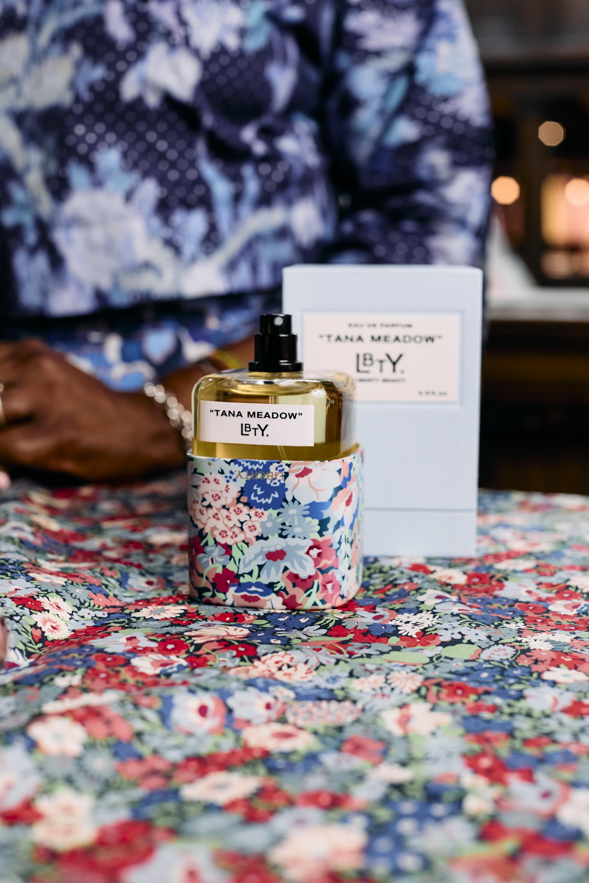 Alison Lewis with Liberty LBTY. Tana Meadow fragrance bottle