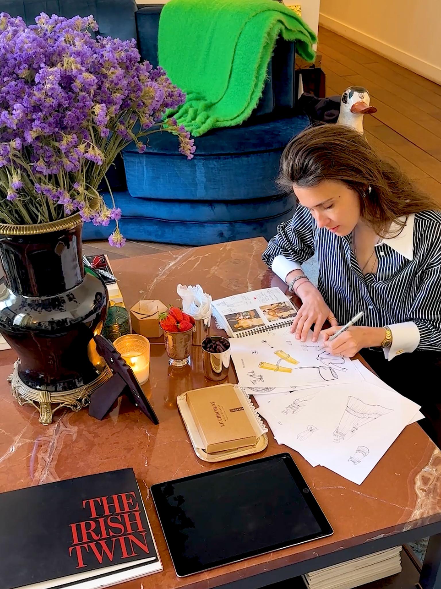 Jill Bauwens, founder of The Irish Twin, sketches in her Parisian studio