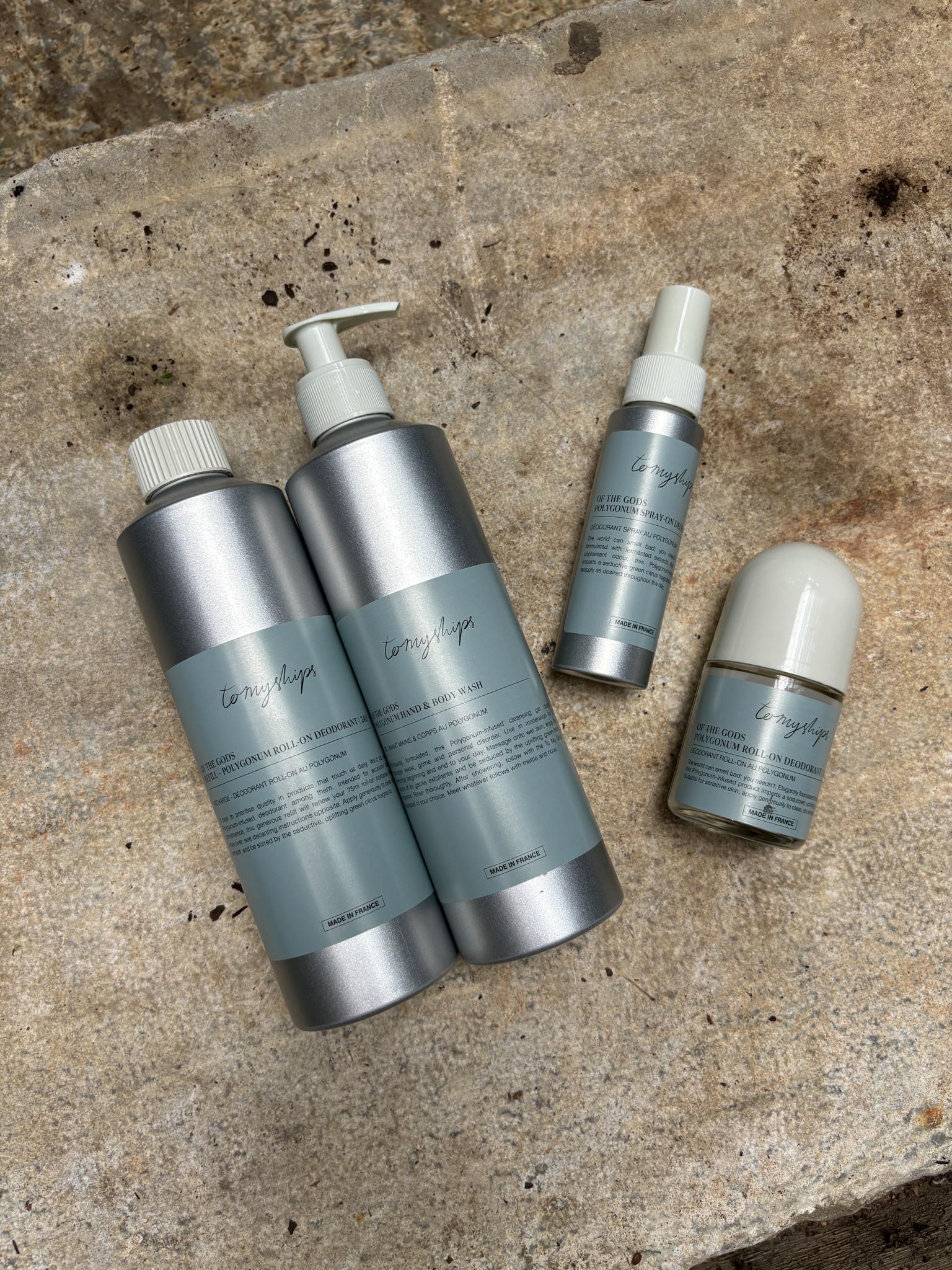 Personal care products on a slate wall