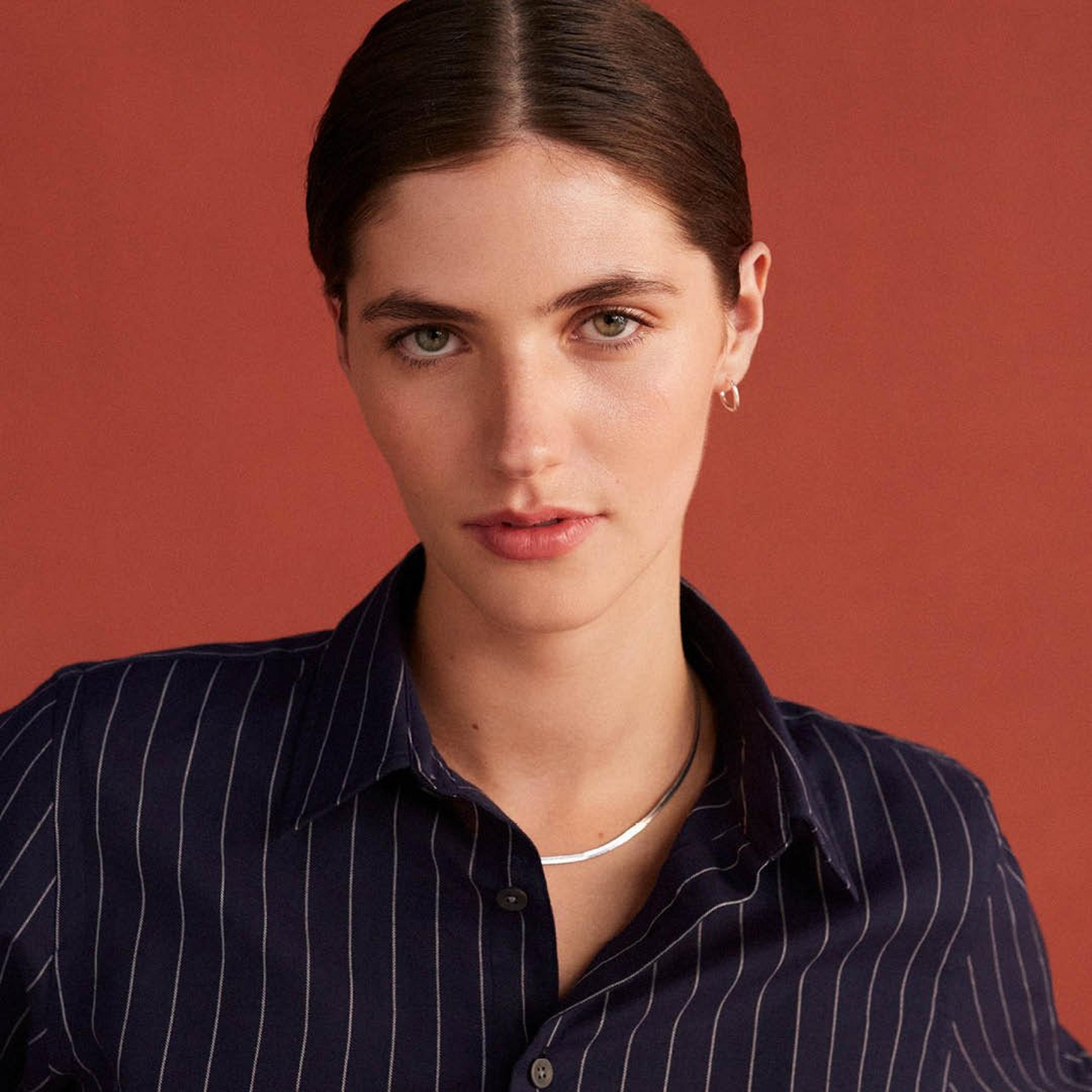 Women wearing navy stripe shirt