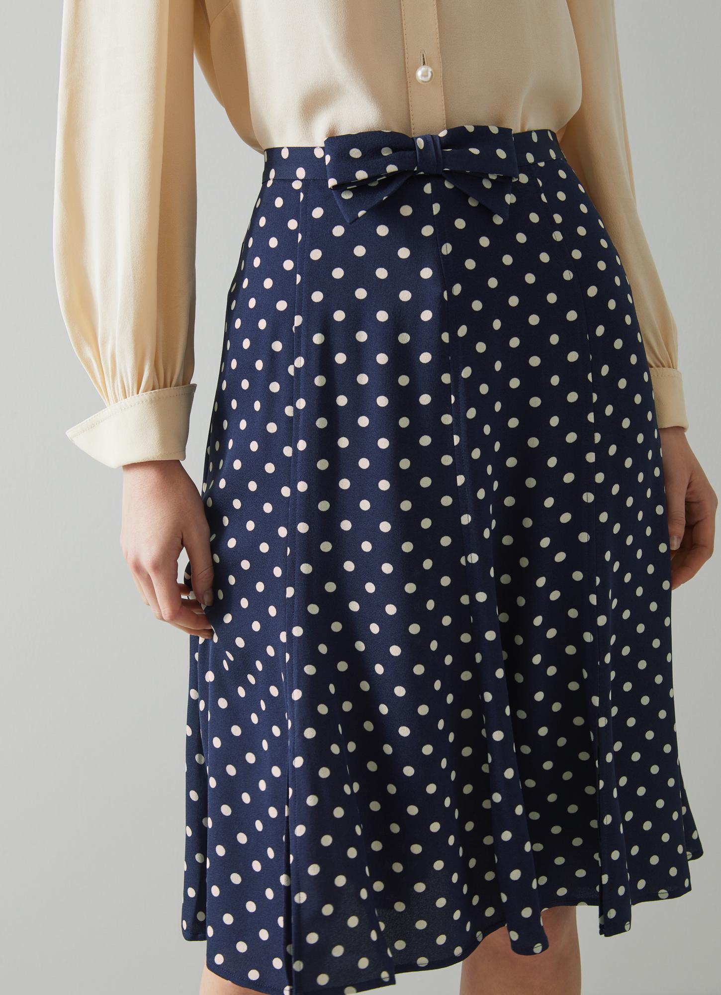 navy and white spotted skirt