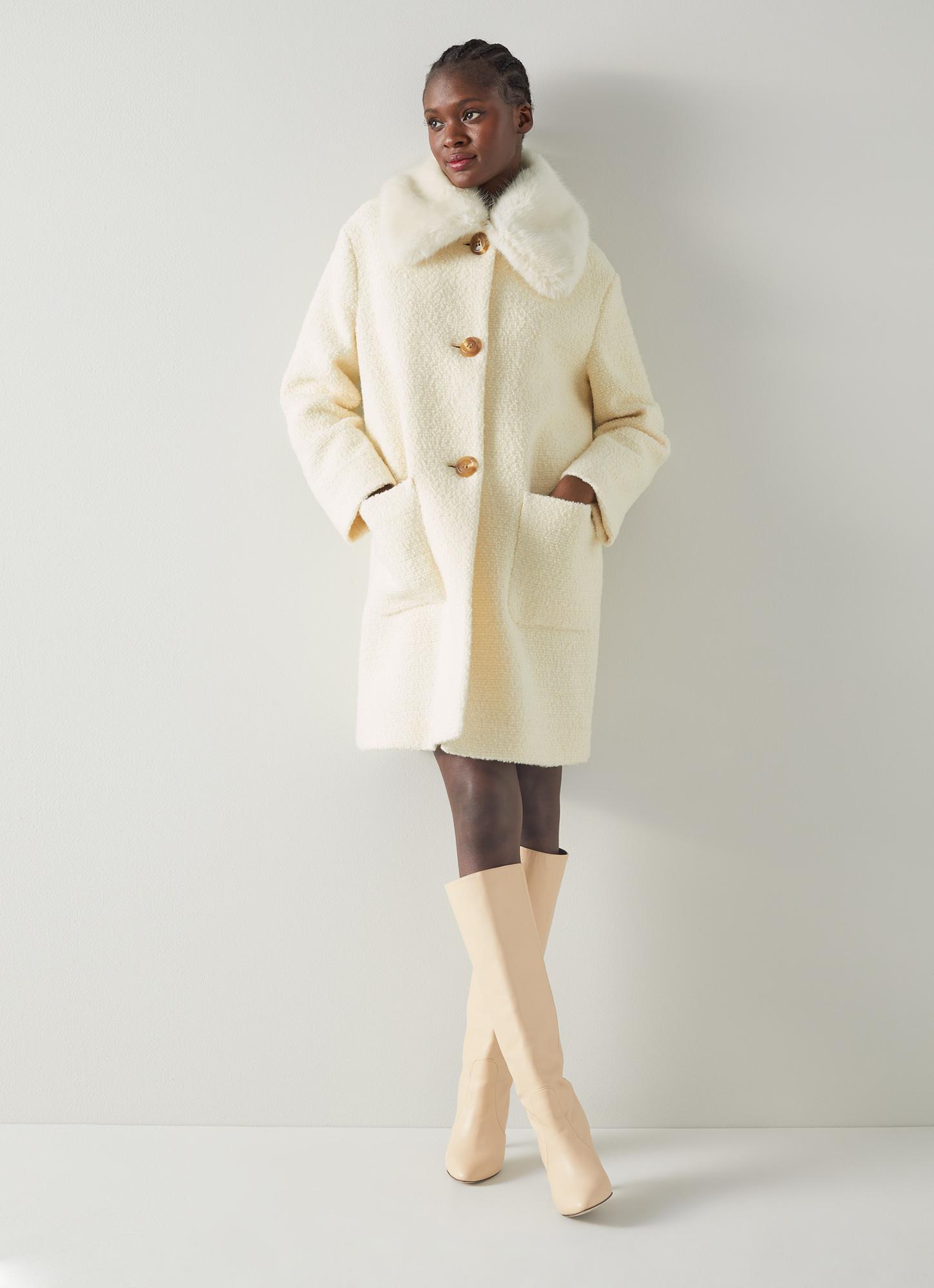 White wool coat with store fur collar