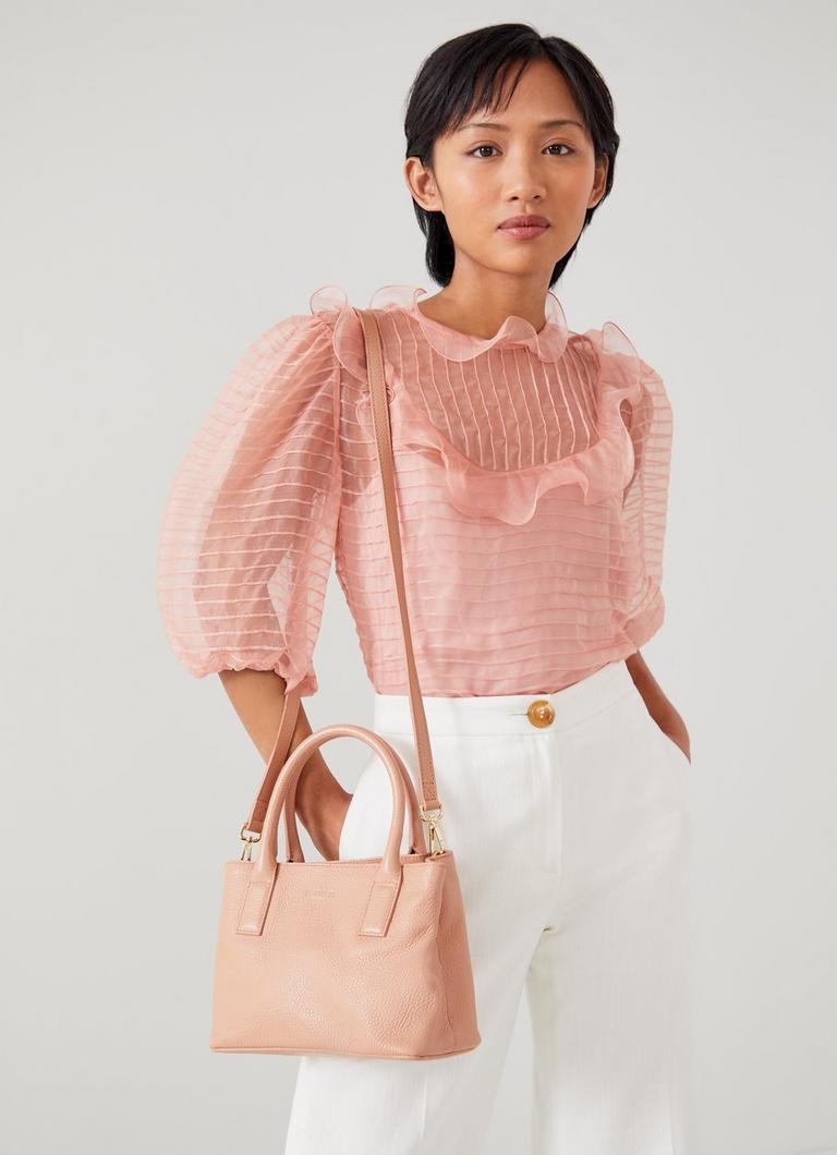 Light pink top leather handbags