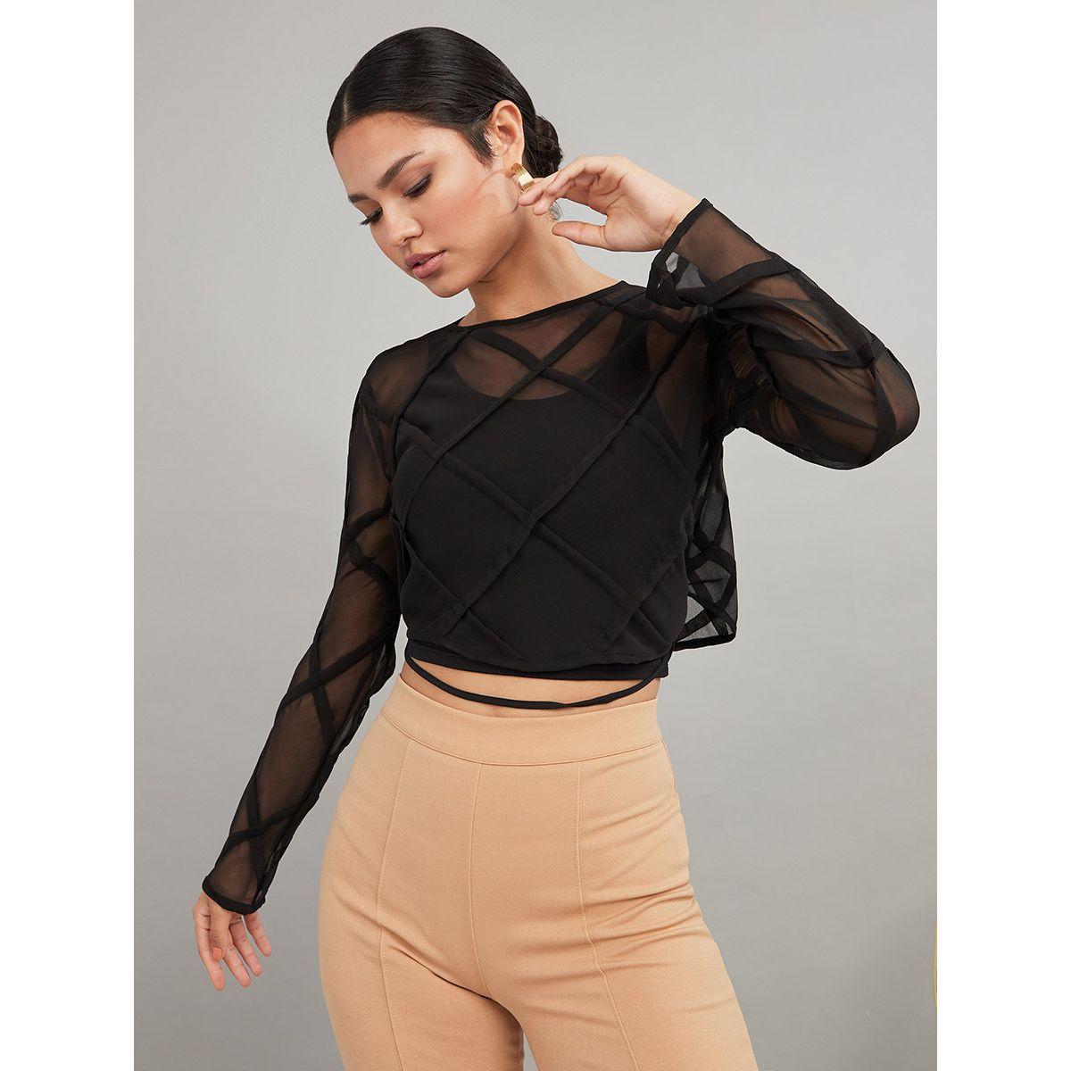 women in sheer blouses