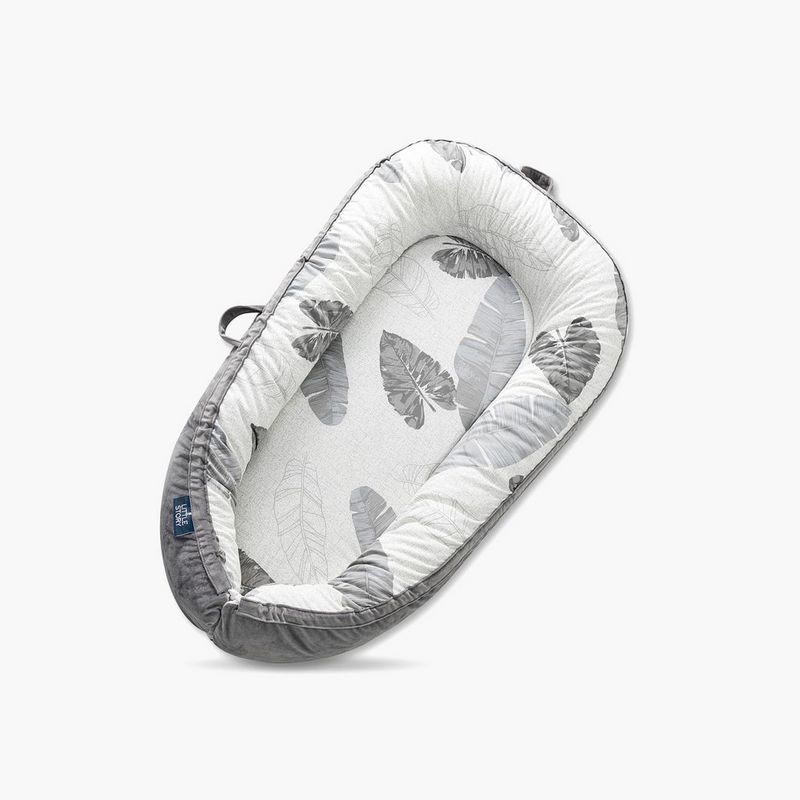 Introducing the Little Story Soft Breathable Newborn Lounger Bed. This innovative baby lounger is crafted with utmost care and attention to detail, ensuring a comfortable and safe environment for your