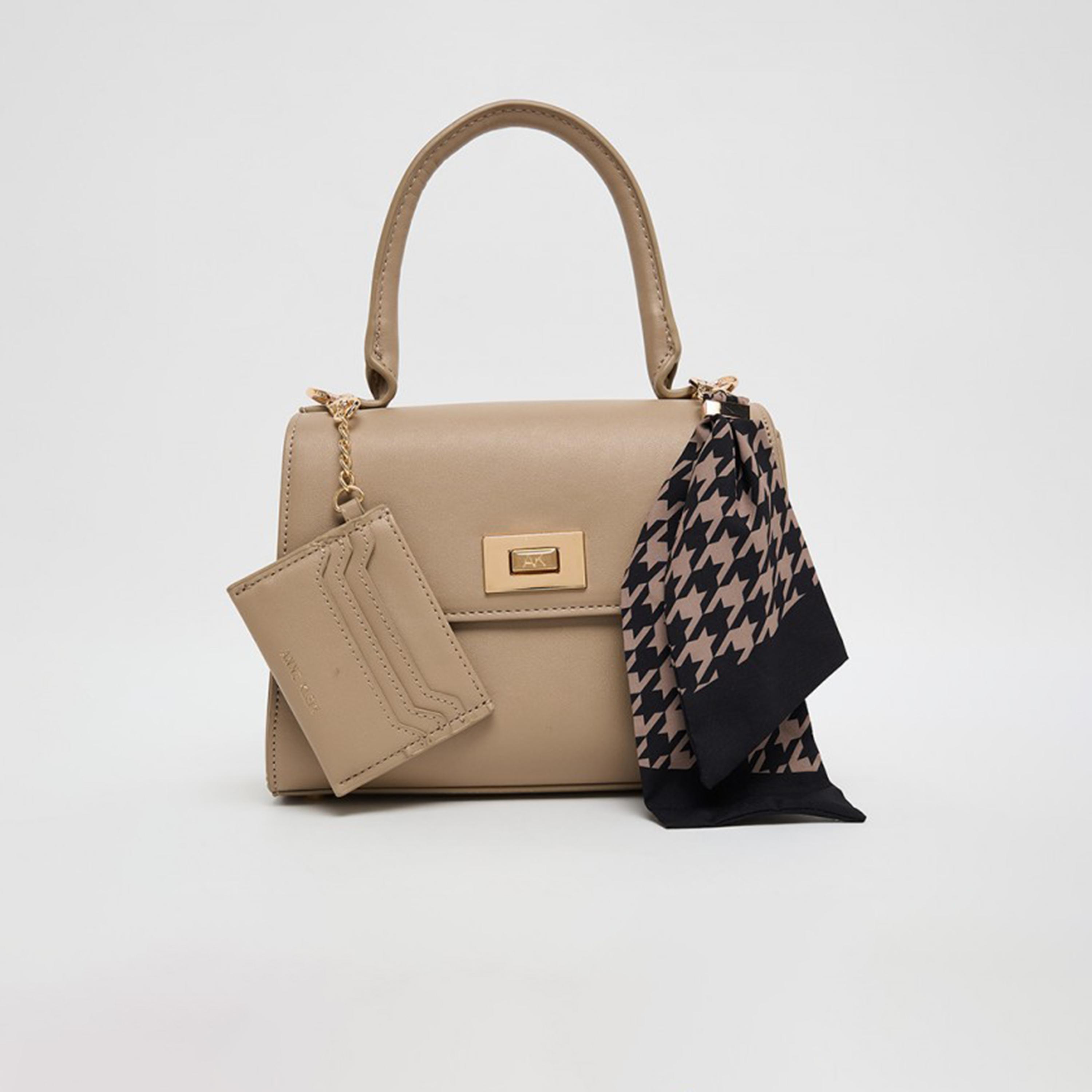 آن كلين - تفاصيل التصميم: شنطة يد بمقبض علوي وقفل دوار-women-bagsandwallets-handbags-image-1