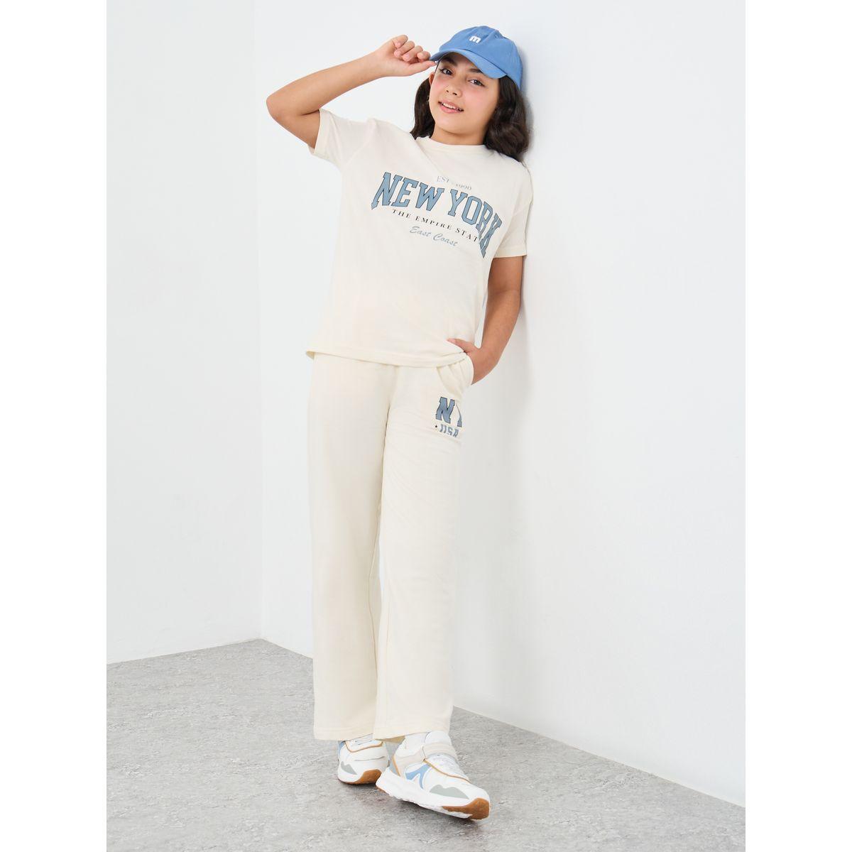 Styli Girls Off White Slogan Print Oversized T-Shirt and Wide Leg Joggers Set-girls-clothing-setsandcoords-image-1