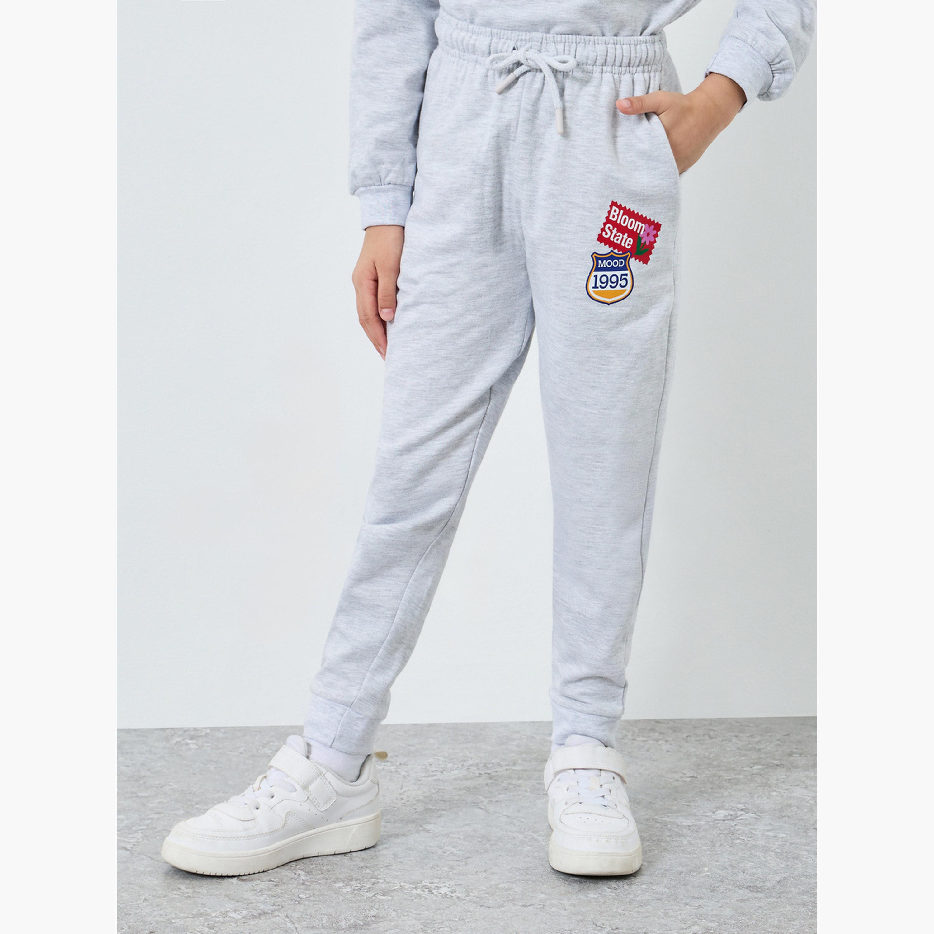 جوغر بحواف مكبلة وطبعة جرافيك-girls-clothing-bottoms-joggersandtrackpants-image-1