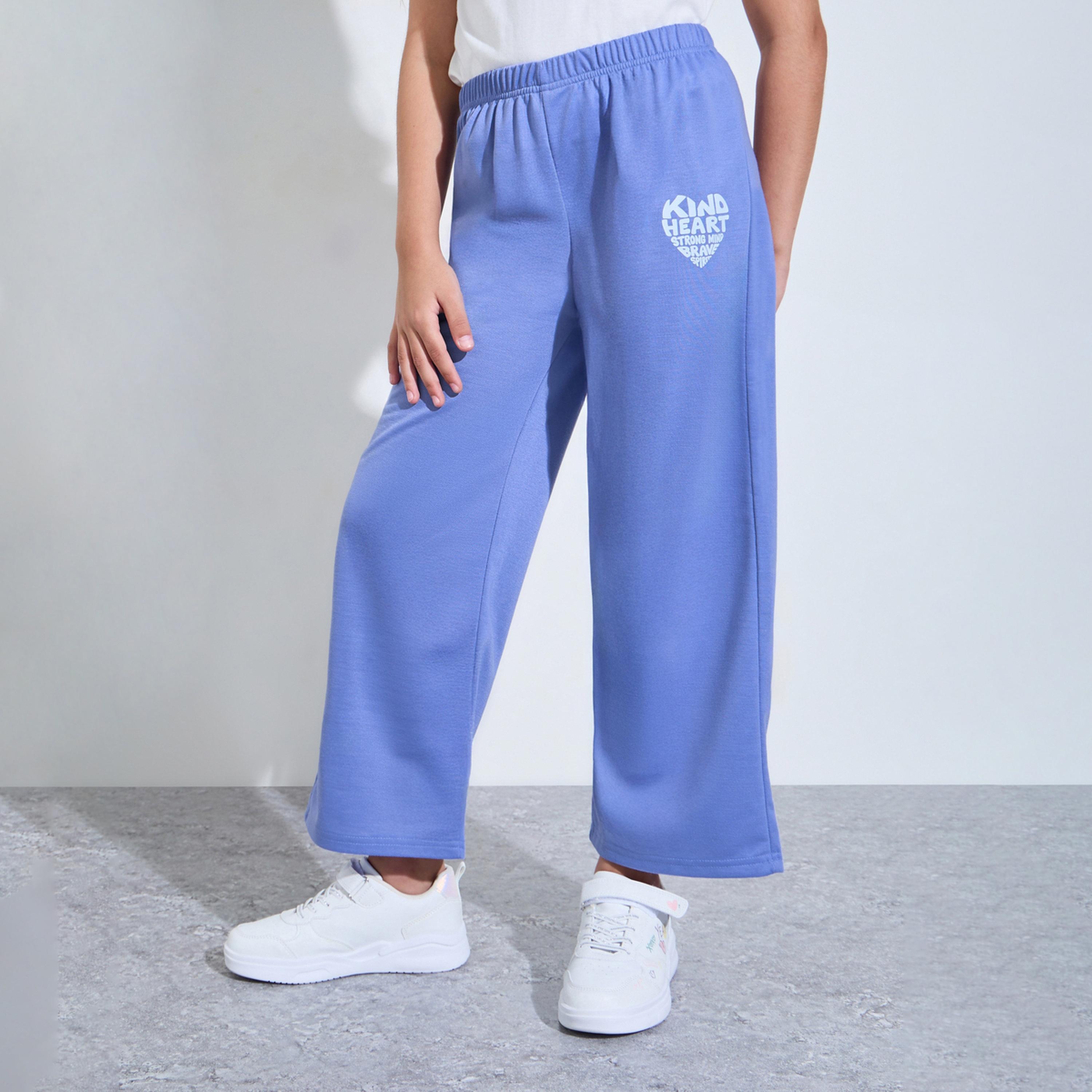 جوغر بأرجل واسعة وطبعة جرافيك للبنات لون أزرق-girls-clothing-bottoms-joggersandtrackpants-image-1